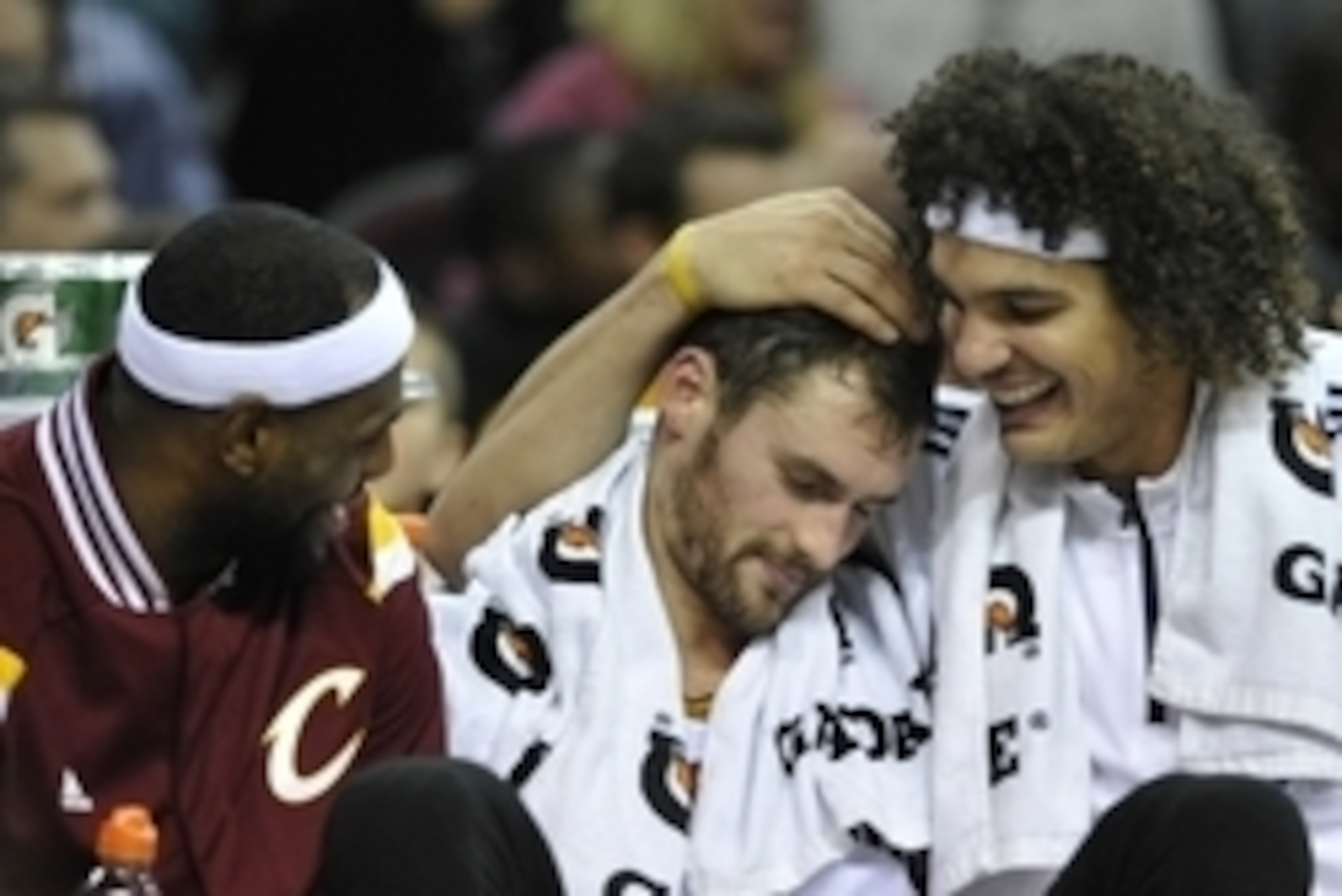 Nov 15, 2014; Cleveland, OH, USA; Cleveland Cavaliers forward LeBron James (left), forward Kevin Love (center) and center Anderson Varejao react while sitting on the bench in the fourth quarter against the Atlanta Hawks at Quicken Loans Arena. Mandatory C