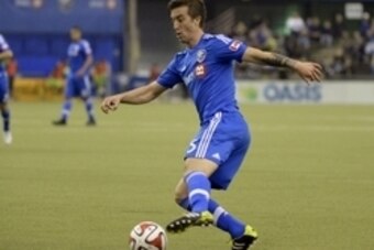 Mar 23, 2014; Montreal, Quebec, Canada; Montreal Impact defender Jeb Brovsky (5) kicks the ball during the second half against the Seattle Sounders at the Olympic Stadium. Mandatory Credit: Eric Bolte-USA TODAY Sports