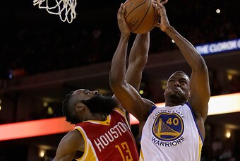 OAKLAND, CA - DECEMBER 10:  Harrison Barnes #40 of the Golden State Warriors goes up for a shot against James Harden #13 of the Houston Rockets at ORACLE Arena on December 10, 2014 in Oakland, California.  NOTE TO USER: User expressly acknowledges and agr