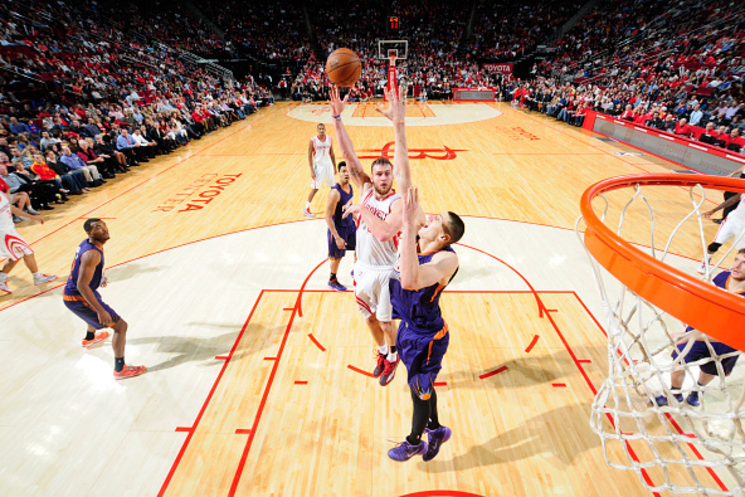 HOUSTON, TX -  DECEMBER 6: Donatas Motiejunas #20 of the Houston Rockets goes up for a shot against the Phoenix Suns on December 6, 2014 at Toyota Center in Houston, Texas. NOTE TO USER: User expressly acknowledges and agrees that, by downloading and or u