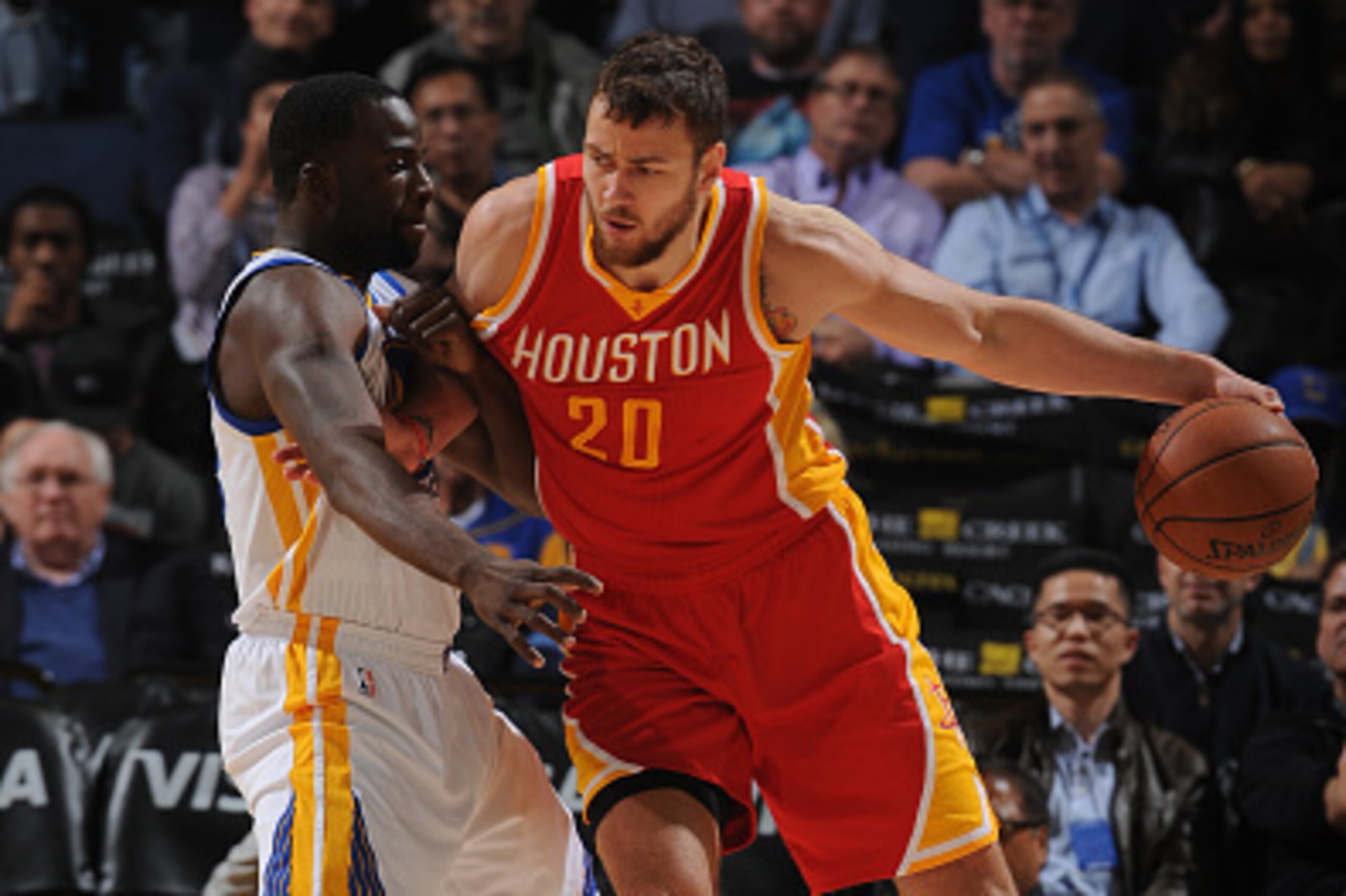 OAKLAND, CA - DECEMBER 10: Donatas Motiejunas #20 of the Houston Rockets posts up against Draymond Green #23 of the Golden State Warriors on December 10, 2014 at Oracle Arena in Oakland, California. NOTE TO USER: User expressly acknowledges and agrees tha