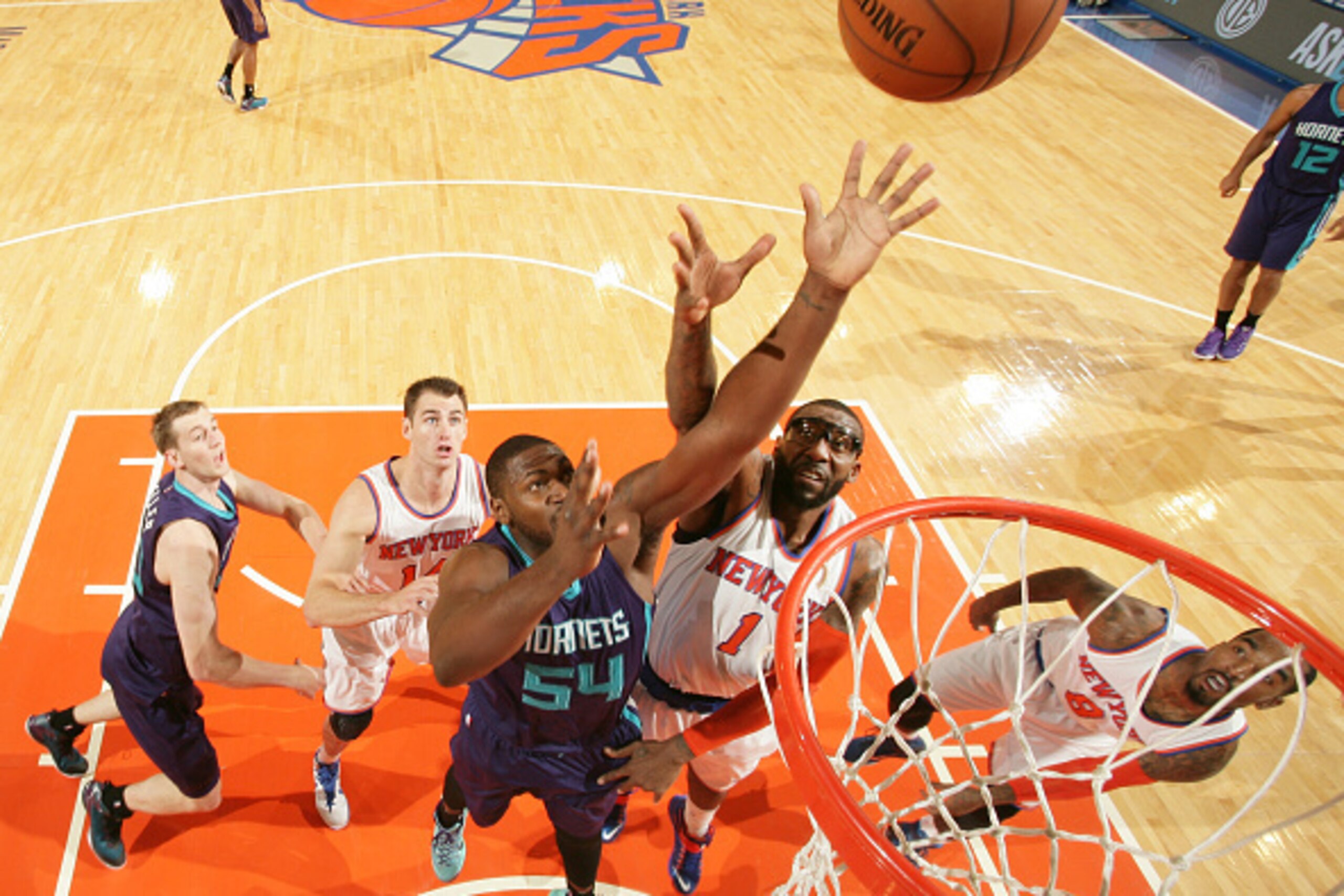 NEW YORK, NY - NOVEMBER 2: Amar'e Stoudemire #1 of the New York Knicks jumps for the ball against Jason Maxiell #54 of the Charlotte Hornets during the game on November 2, 2014 at Madison Square Garden in New York City, New York. NOTE TO USER: User expres