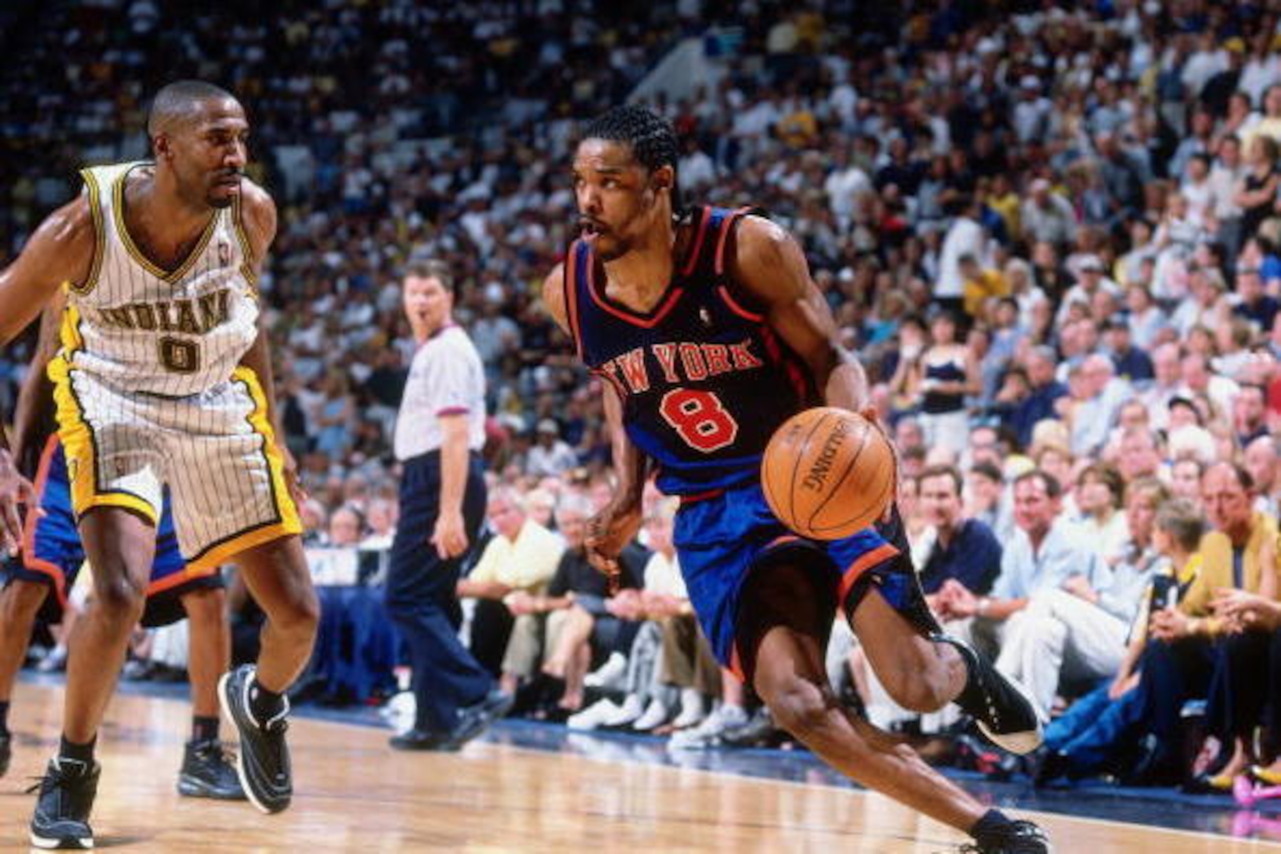 INDIANAPOLIS - MAY 30:  Latrell Sprewell #8 of the New York Knicks drives the ball against Derrick McKey #9 of the Indiana Pacers in Game One of the Eastern Conference Finals during the 1999 NBA Playoffs at Market Square Arena on May 30, 1999 in Indianapo