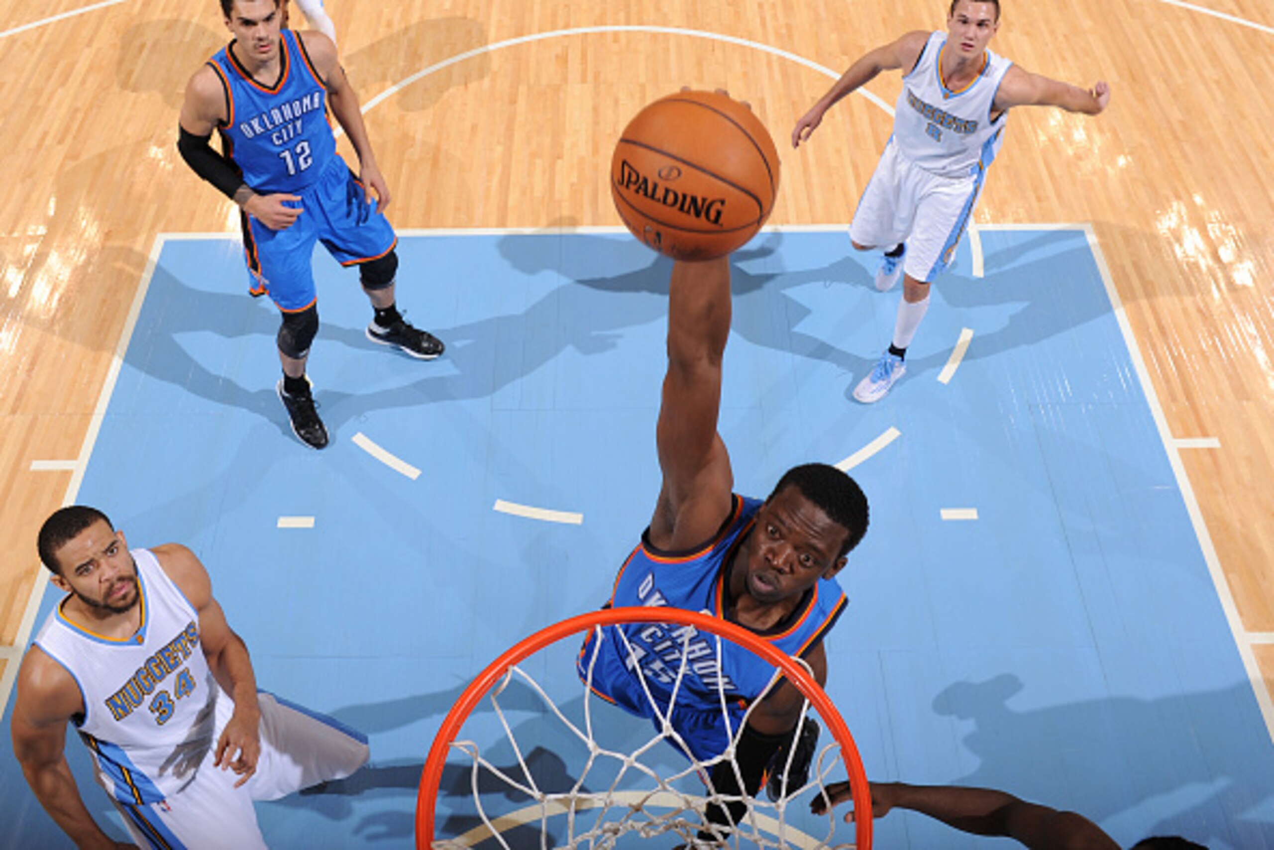 DENVER, CO - NOVEMBER 19:  Reggie Jackson #15 of the Oklahoma City Thunder dunks against the Denver Nuggets on November 19, 2014 at Pepsi Center in Denver, Colorado. NOTE TO USER: User expressly acknowledges and agrees that, by downloading and or using th