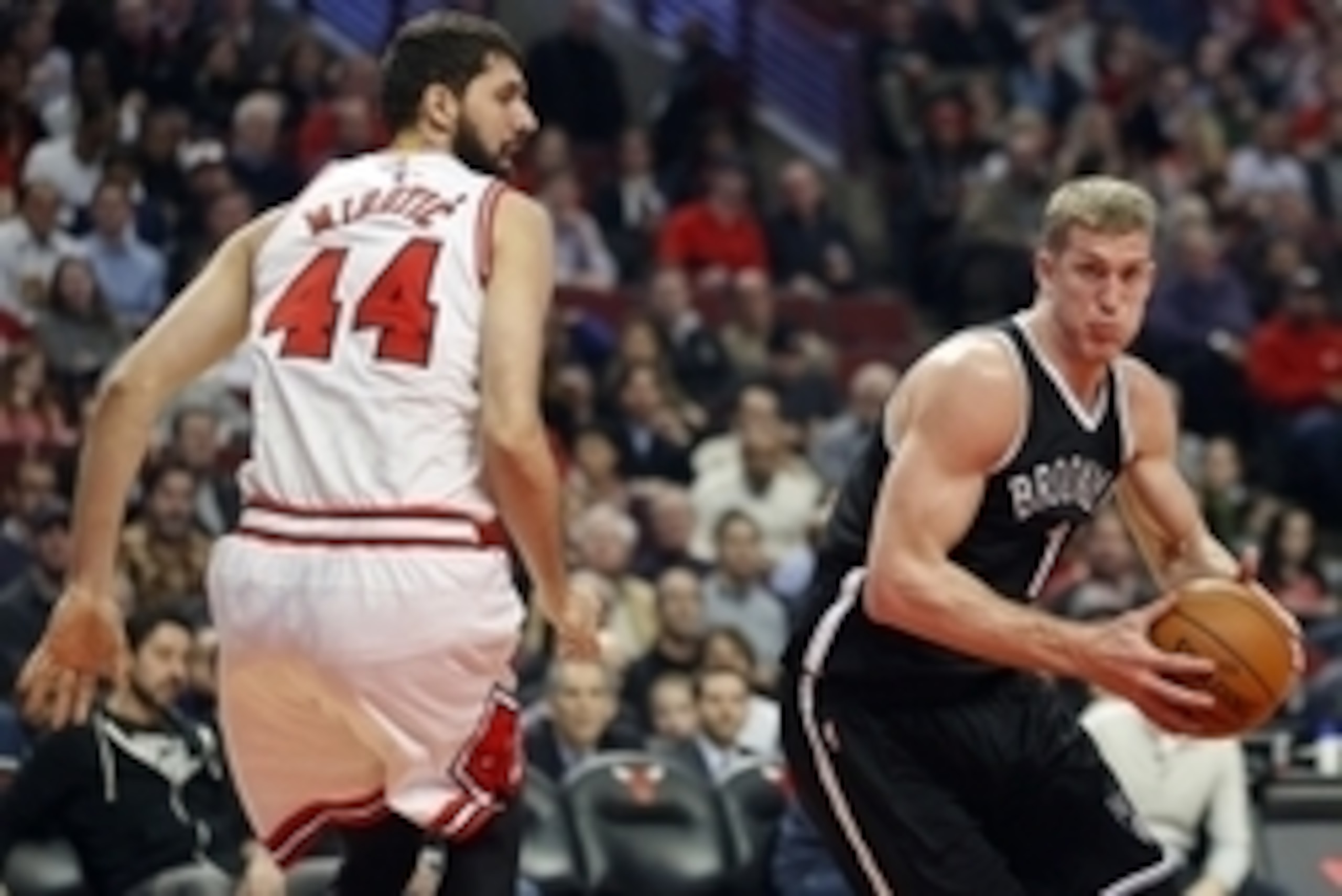Dec 10, 2014; Chicago, IL, USA; Brooklyn Nets center Mason Plumlee (1) goes to the basket against Chicago Bulls forward Nikola Mirotic (44) during the first half of their NBA game at United Center. Mandatory Credit: Kamil Krzaczynski-USA TODAY Sports