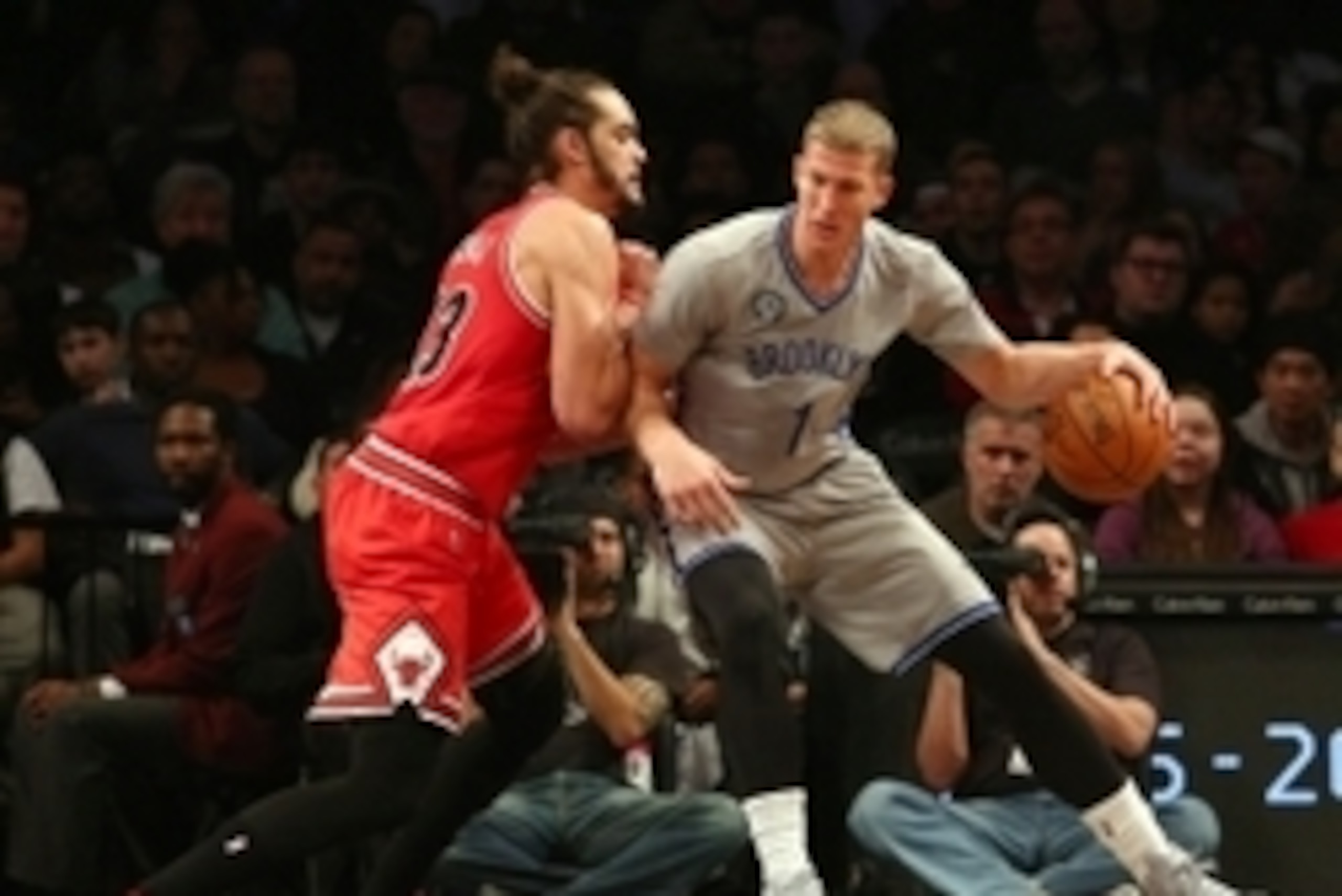 Nov 30, 2014; Brooklyn, NY, USA; Brooklyn Nets center Mason Plumlee (1) dribbles the ball as Chicago Bulls center Joakim Noah (13) defends during the second quarter at Barclays Center. Mandatory Credit: Brad Penner-USA TODAY Sports