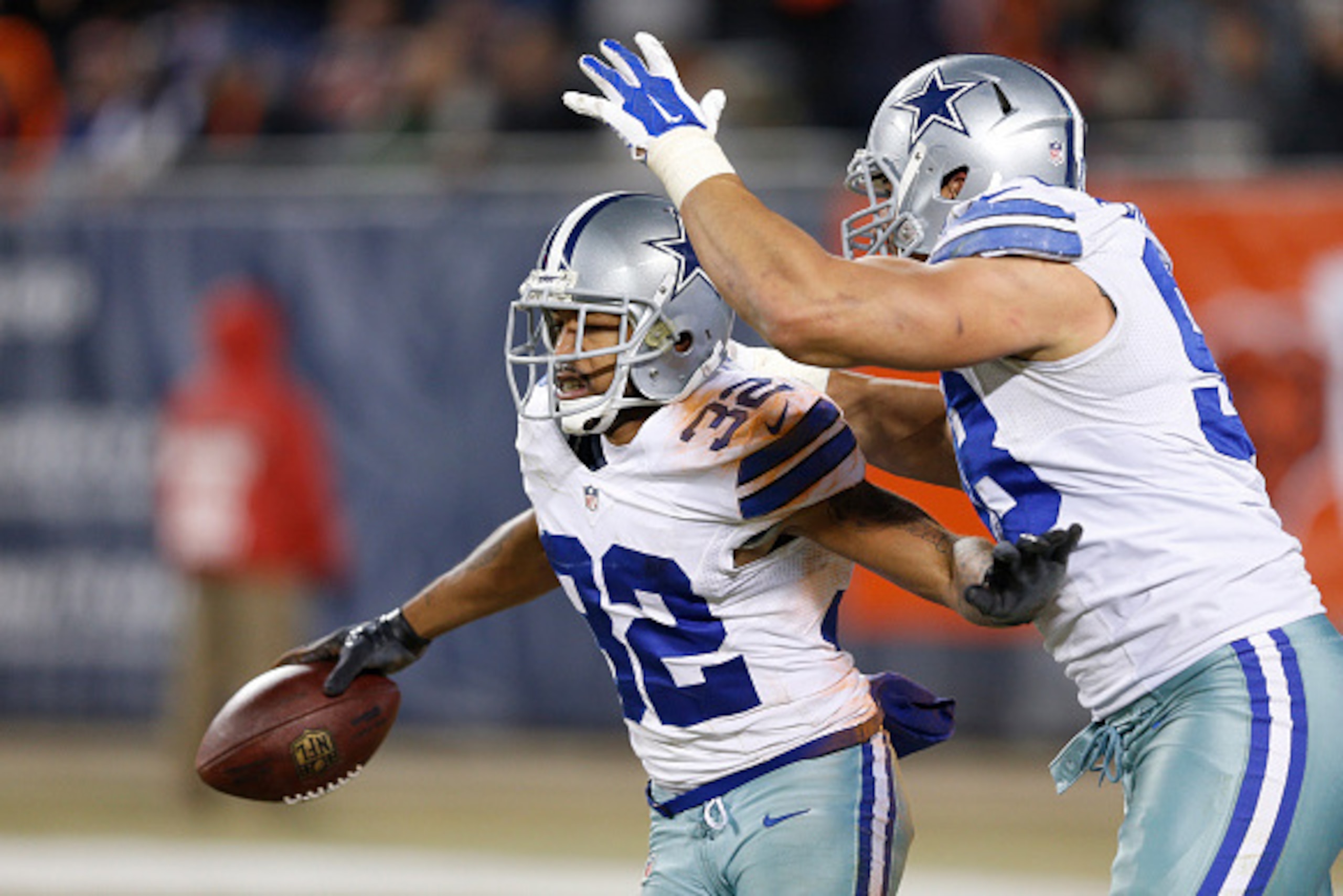 CHICAGO, IL - DECEMBER 4: Orlando Scandrick #32 of the Dallas Cowboys celebrates after a fourth quarter interception against the Chicago Bears during the game at Soldier Field on December 4, 2014 in Chicago, Illinios. The Cowboys defeated the Bears 41-28.