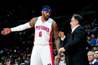 AUBURN HILLS, MI - NOVEMBER 26: Josh Smith #6 and Stan Van Gundy of the Detroit Pistons speak during a game against the Los Angeles Clippers on November 26, 2014 at The Palace of Auburn Hills in Auburn Hills, Michigan. NOTE TO USER: User expressly acknowl