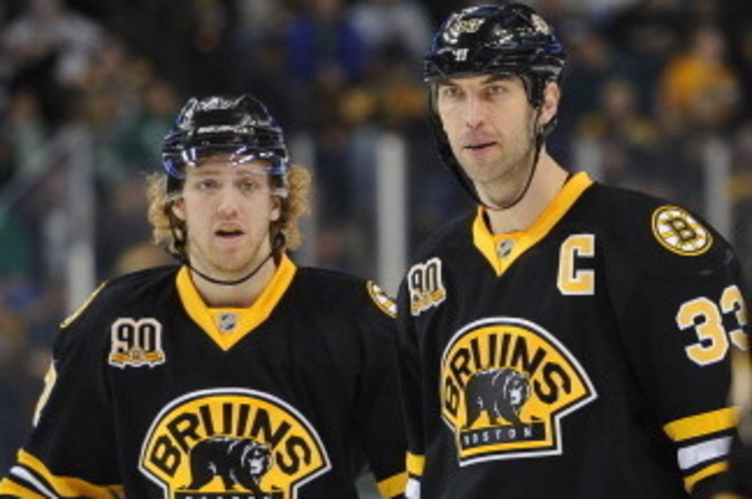 BOSTON, MA - MARCH 17: Dougie Hamilton #27 and Zdeno Chara #33 of the Boston Bruins chat before a play against the Minnesota Wild at the TD Garden on March 17, 2014 in Boston, Massachusetts.  (Photo by Brian Babineau/NHLI via Getty Images)