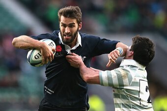 LONDON, ENGLAND - DECEMBER 11:  Matt Janney of Oxford  holds off Thomas Pascoe during the Varsity match between Oxford University and Cambridge University at Twickenham Stadium on December 11, 2014 in London, England.  (Photo by David Rogers/Getty Images)