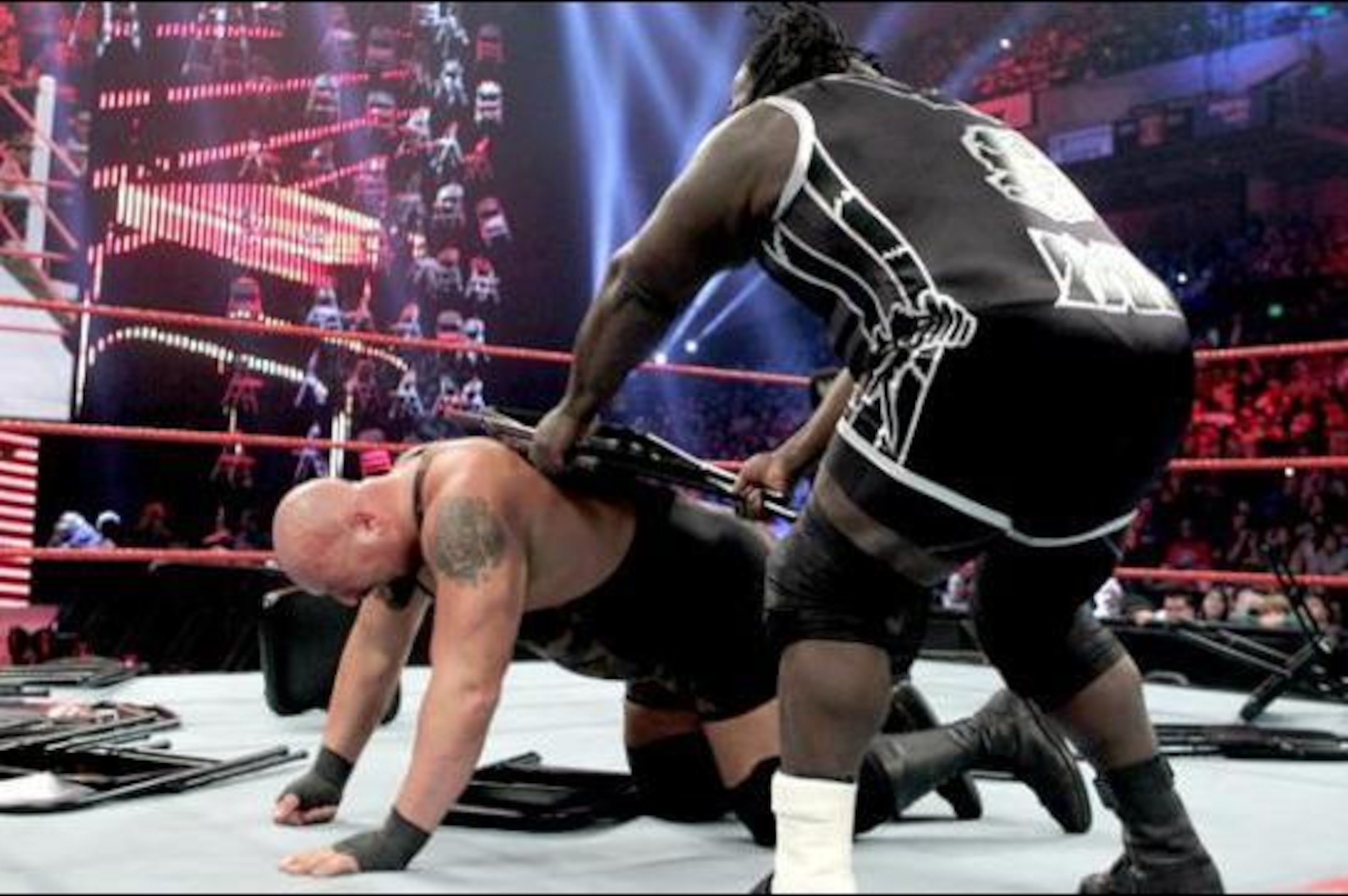 Mark Henry hits Big Show with a chair shot. Mark Henry hits Big Show with a chair shot.