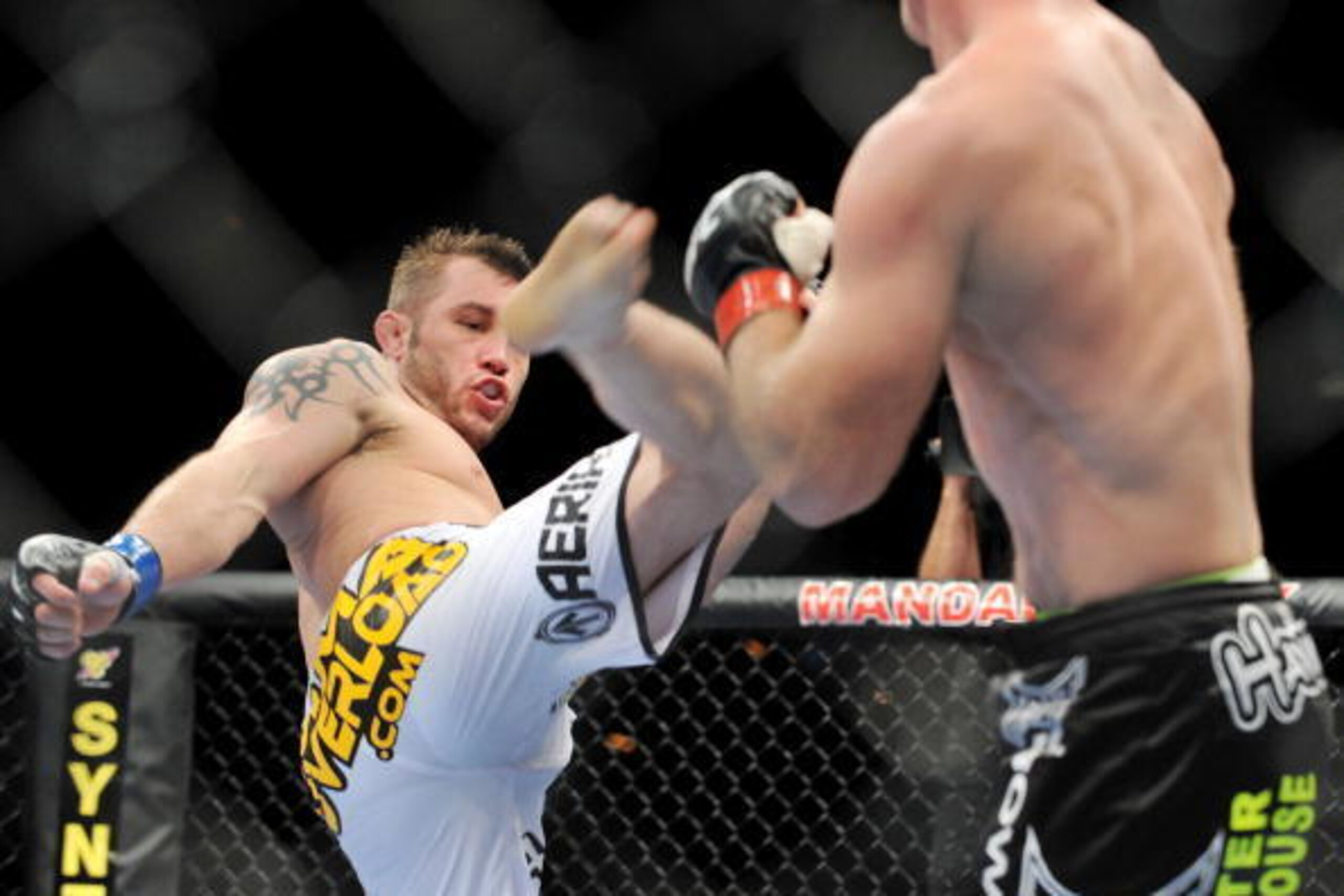 LAS VEGAS - NOVEMBER 21: Brian Foster (L) battles Brock Larson (R) during their Welterweight Fight at the UFC 106 at Mandalay Bay Events Center on November 21, 2009 in Las Vegas, Nevada. (Photo by Jon Kopaloff/Getty Images)