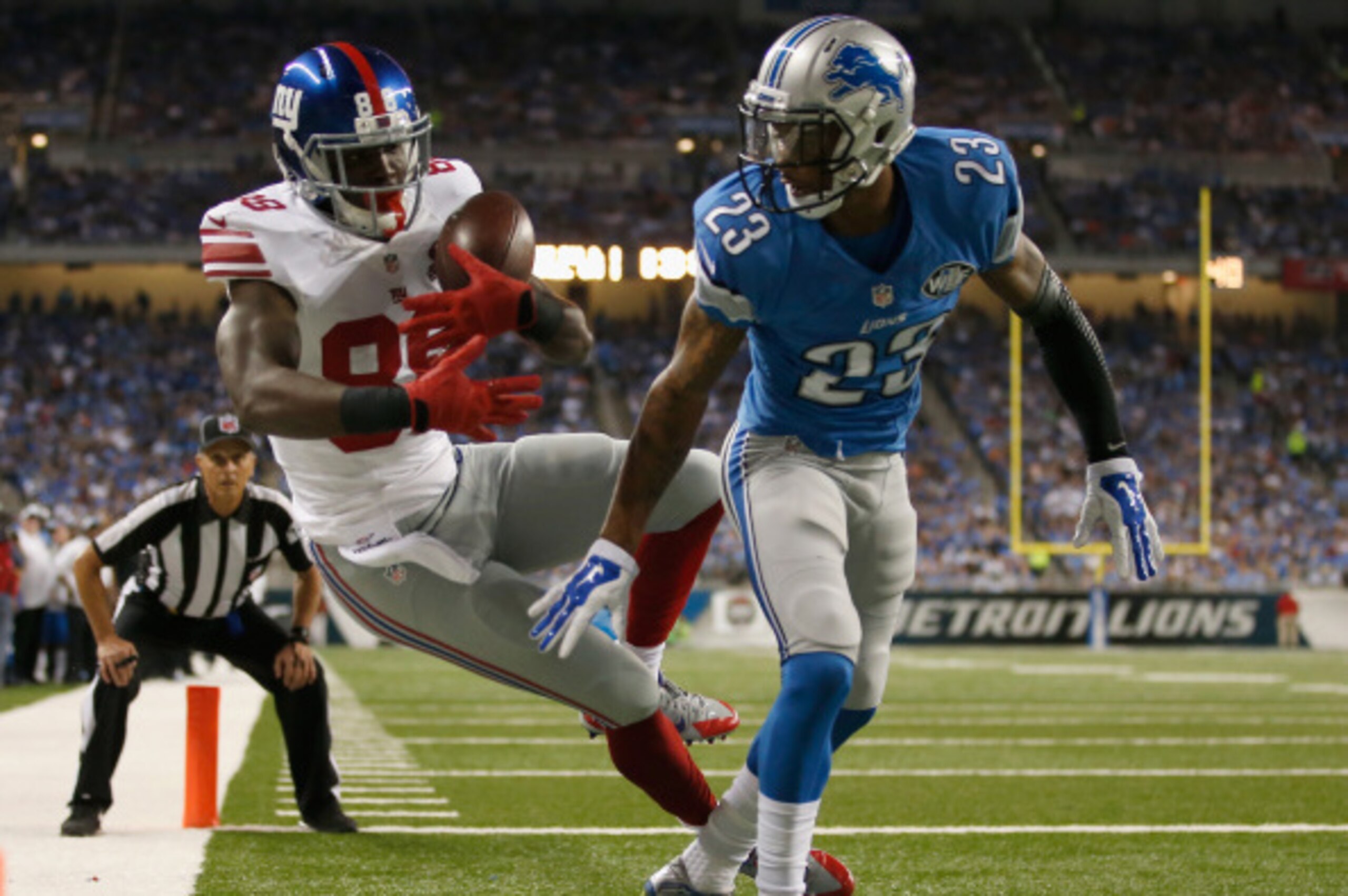 DETROIT, MI - SEPTEMBER 08: Corey Washington #88 of the New York Giants can't come up with a second quarter touchdown catch while being defended by Darius Slay #23 of the Detroit Lions at Ford Field on September 8, 2014 in Detroit, Michigan. (Photo by Gre