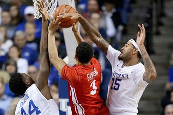 LEXINGTON, KY - NOVEMBER 21:  Dakari Johnson #44 and Willie Cauley-Stein #15 of the Kentucky Wildcats defend the shot of  Eric Fanning #3 of the Boston Terriers battle for a loose ball at Rupp Arena on November 21, 2014 in Lexington, Kentucky.  (Photo by 