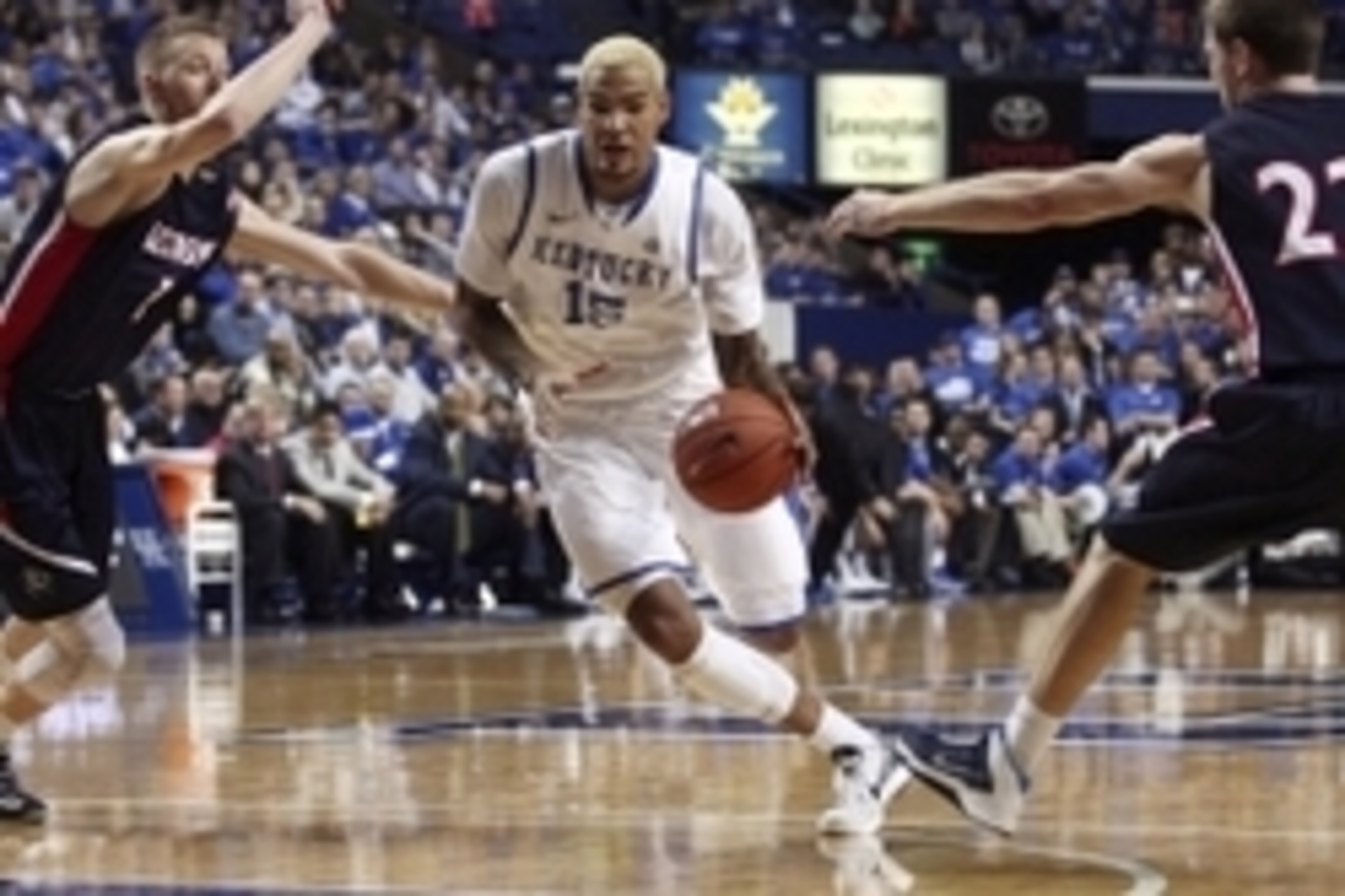 Dec 21, 2013; Lexington, KY, USA; Kentucky Wildcats forward Willie Cauley-Stein (15) dribbles the ball against Belmont Bruins forward Drew Windler (1) and guard Reece Chamberlain (22) in the first half at Rupp Arena. Mandatory Credit: Mark Zerof-USA TODAY Dec 21, 2013; Lexington, KY, USA; Kentucky Wildcats forward Willie Cauley-Stein (15) dribbles the ball against Belmont Bruins forward Drew Windler (1) and guard Reece Chamberlain (22) in the first half at Rupp Arena. Mandatory Credit: Mark Zerof-USA TODAY