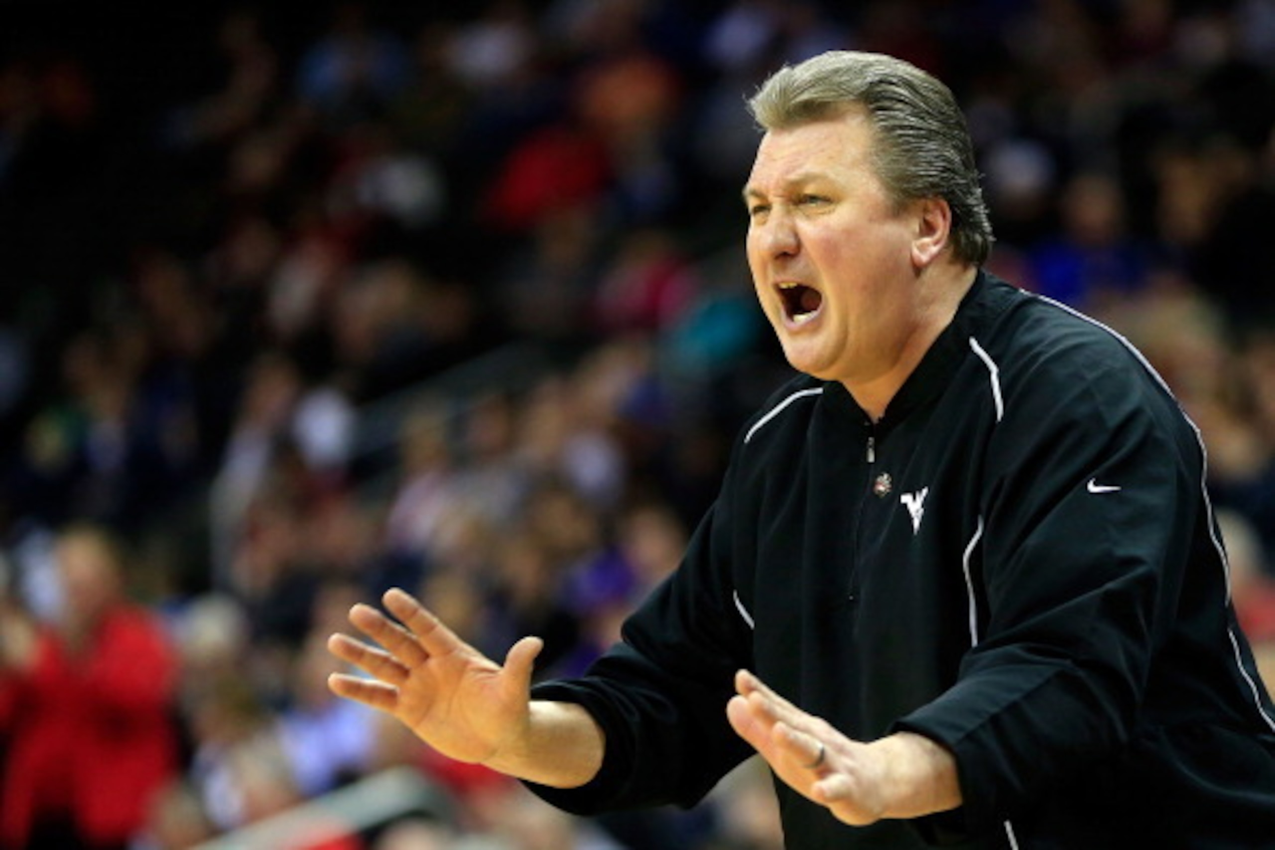 KANSAS CITY, MO - MARCH 13:  Head coach Bob Huggins of the West Virginia Mountaineers reacts from the bench during the first round of the 2013 Big 12 Men's Basketball Championship against the Texas Tech Red Raiders at Sprint Center on March 13, 2013 in Ka