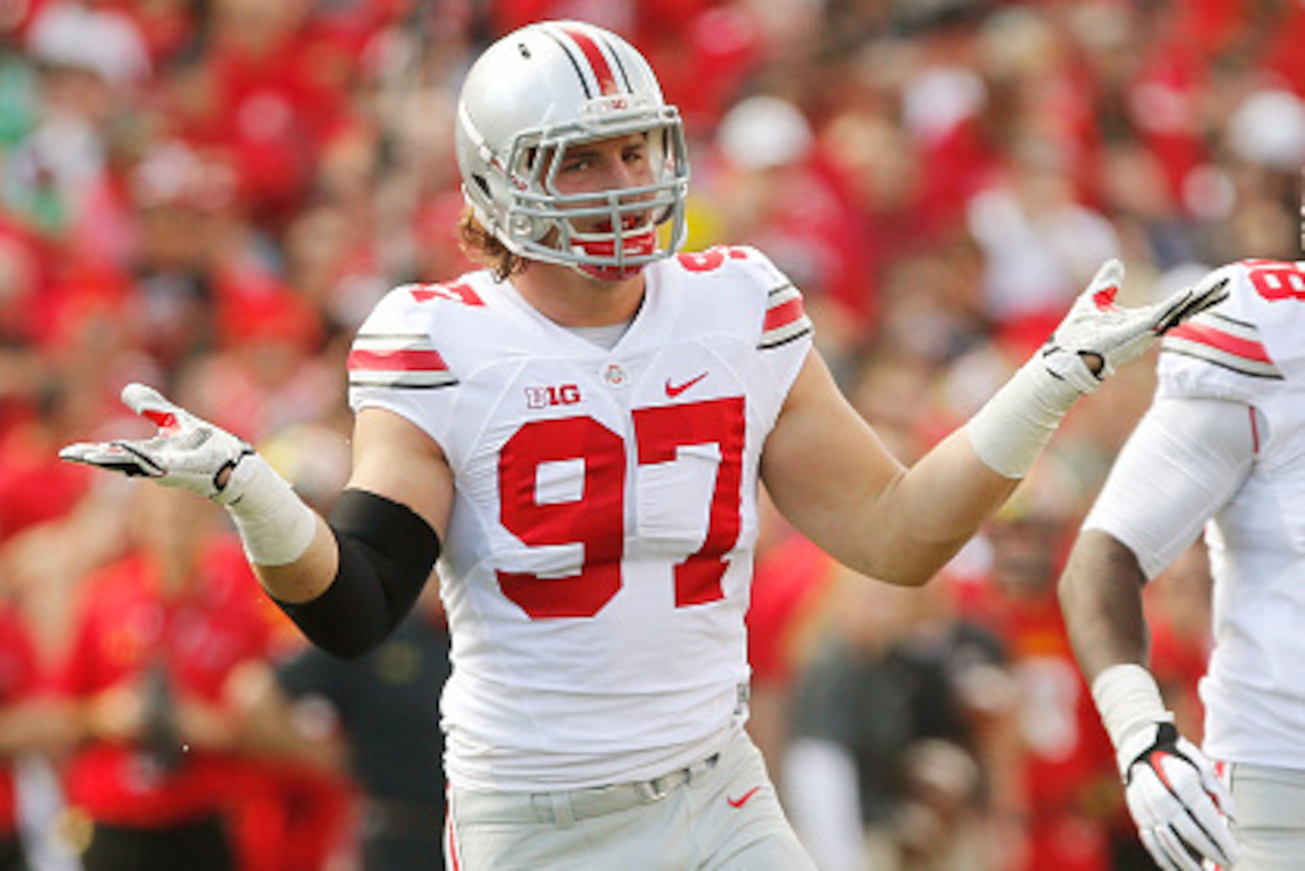 COLLEGE PARK, MD - OCTOBER 04:  Defensive end Joey Bosa #97 of the Ohio State Buckeyes celebrates after one of his first-half sacks against the Maryland Terrapins at Byrd Stadium on October 4, 2014 in College Park, Maryland. Also pictured is teammate Stev