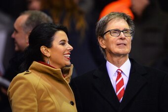 LIVERPOOL, ENGLAND - JANUARY 18:  Liverpool co-owner John Henry looks on with wife Linda Pizzuti prior to the Barclays Premier League match between Liverpool and Aston Villa at Anfield on January 18, 2014 in Liverpool, England.  (Photo by Michael Regan/Ge