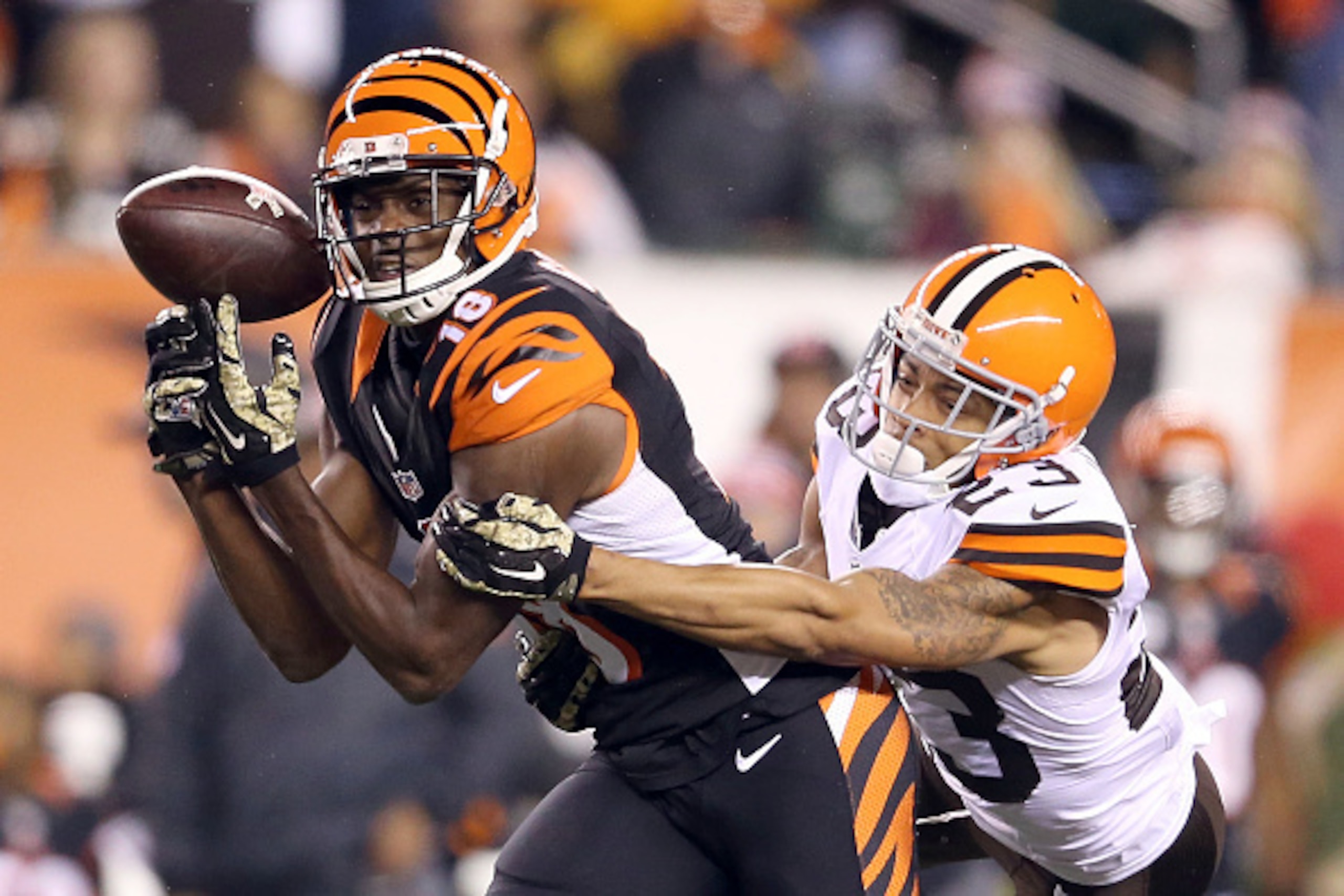 CINCINNATI, OH - NOVEMBER 6 :  A.J. Green #18 of the Cincinnati Bengals drops a pass while being defended by Joe Haden #23 of the Cleveland Browns during the third quarter at Paul Brown Stadium on November 6, 2014 in Cincinnati, Ohio. (Photo by Andy Lyons