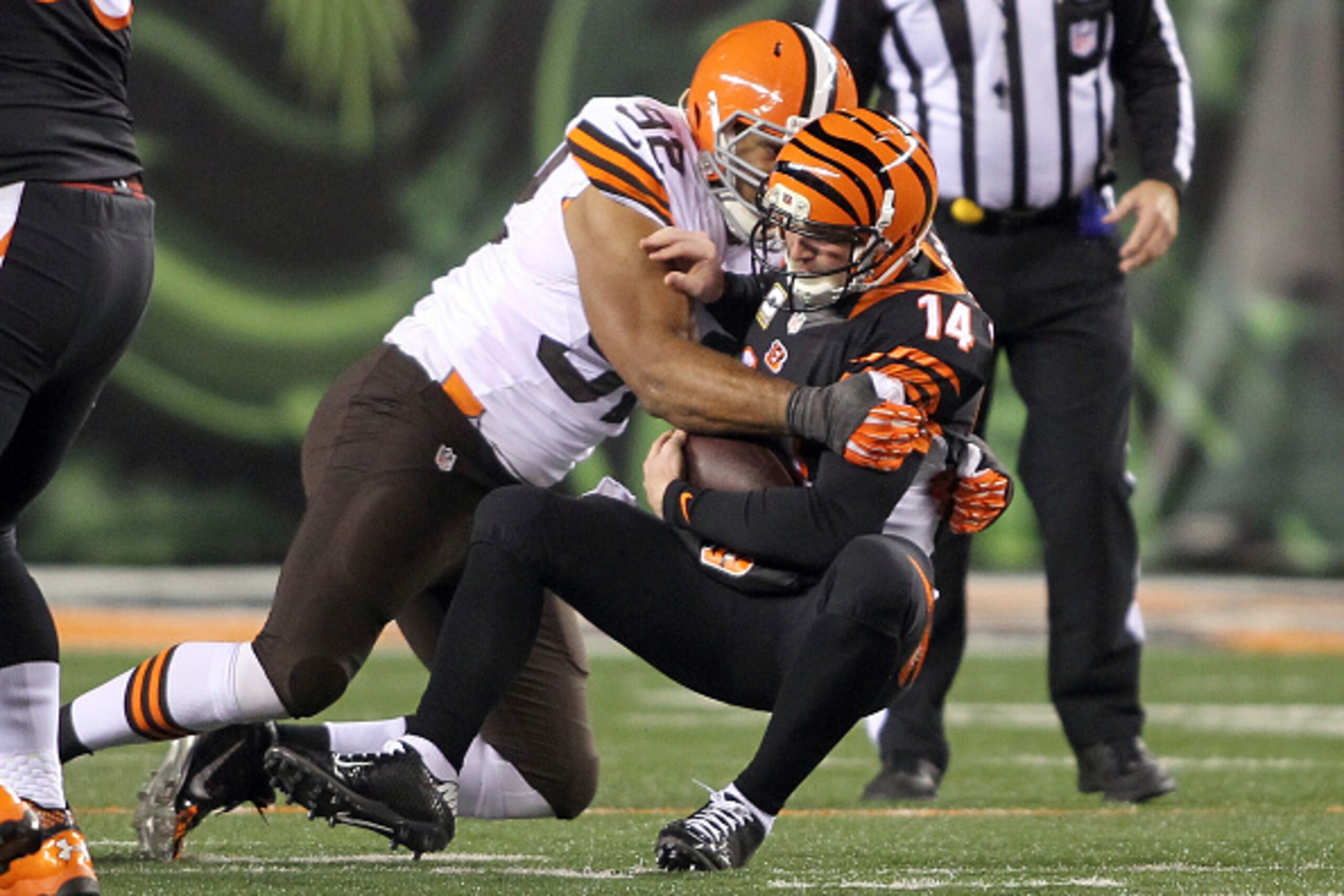 CINCINNATI, OH - NOVEMBER 6:  Desmond Bryant #92 of the Cleveland Browns sacks Andy Dalton #14 of the Cincinnati Bengals during the third quarter at Paul Brown Stadium on November 6, 2014 in Cincinnati, Ohio. (Photo by John Grieshop/Getty Images)