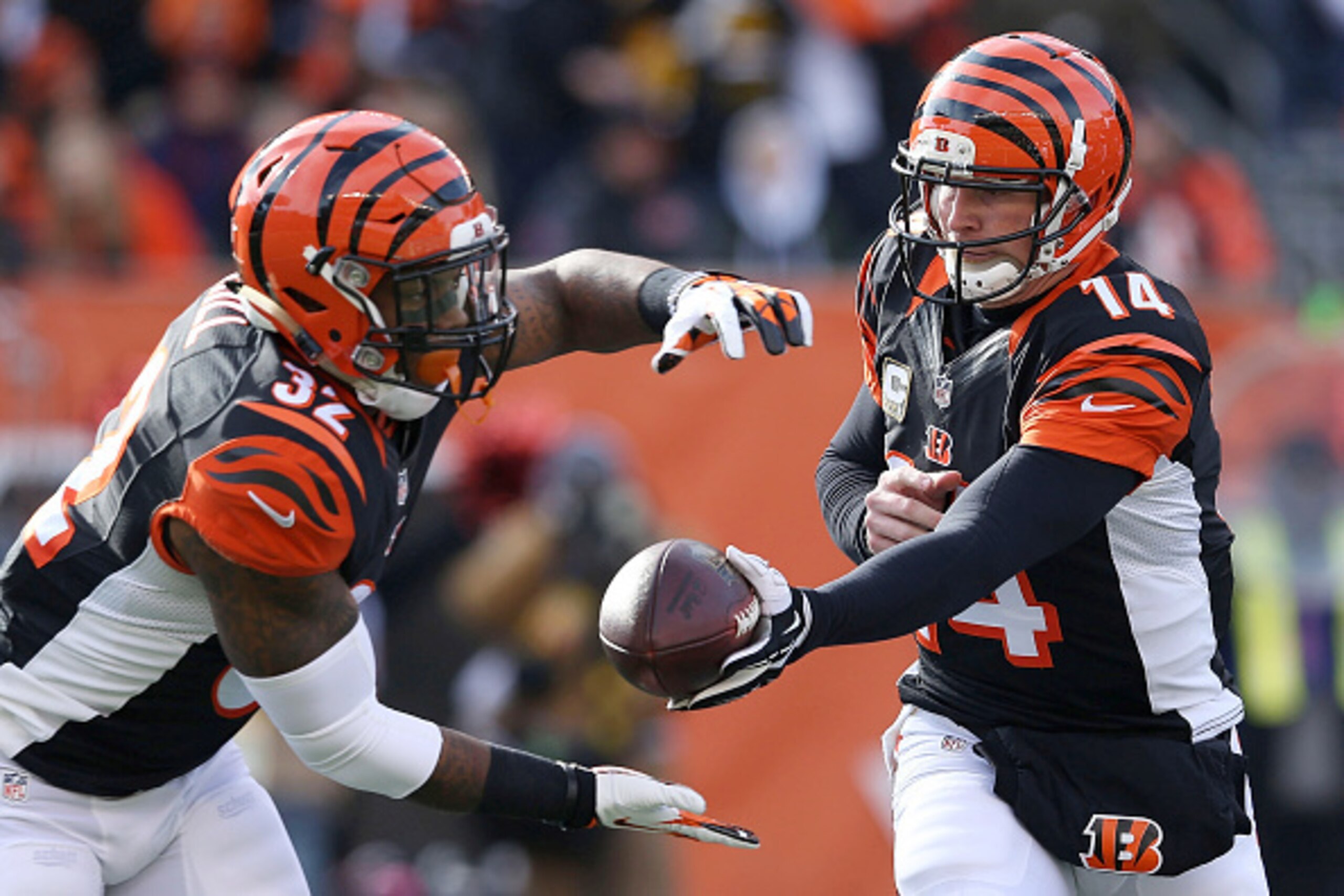 CINCINNATI, OH - DECEMBER 7:  Andy Dalton #14 of the Cincinnati Bengals hands the ball off to Jeremy Hill #32 of the Cincinnati Bengals during the first quarter of the game against the Pittsburgh Steelers at Paul Brown Stadium on December 7, 2014 in Cinci