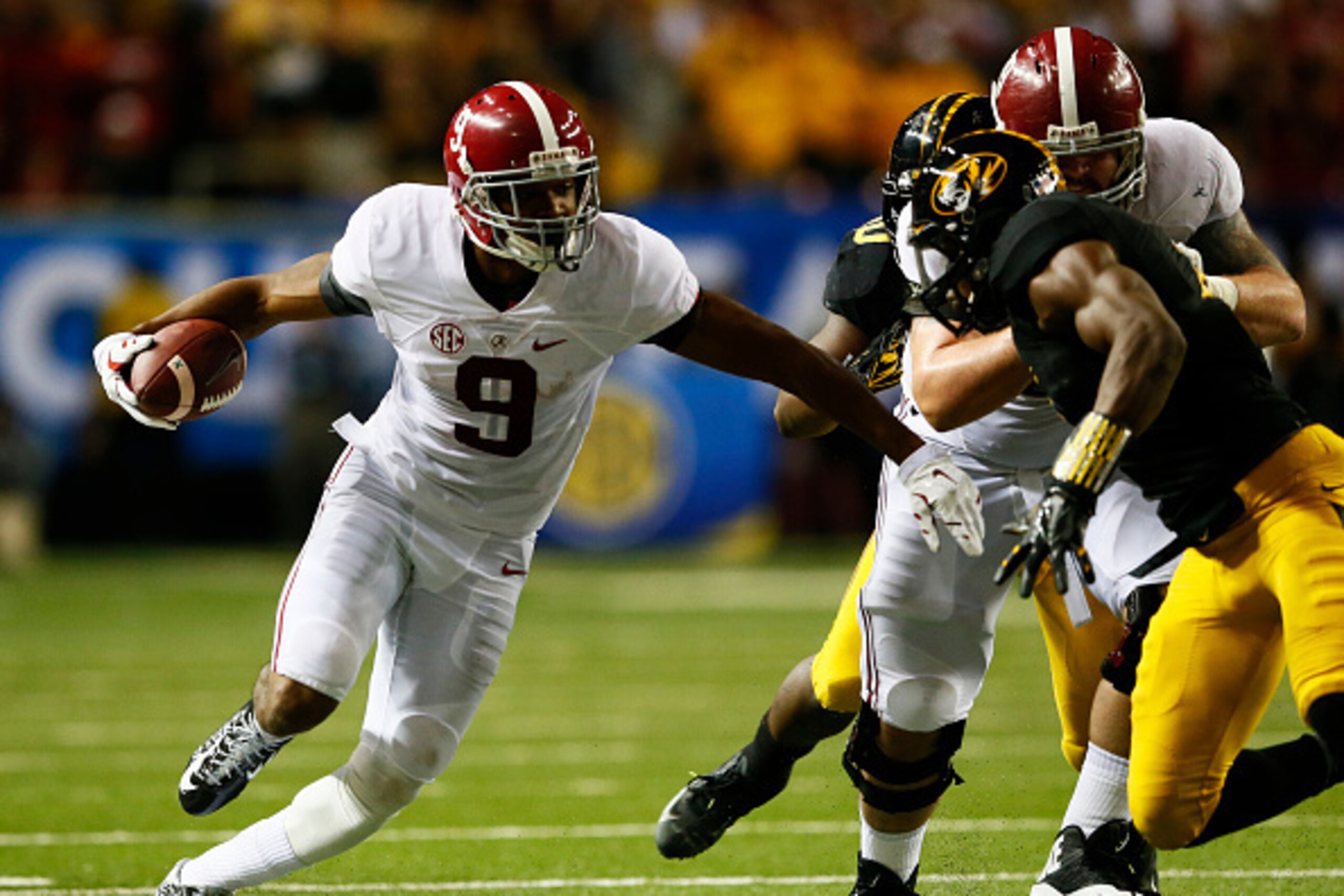 ATLANTA, GA - DECEMBER 06:  Amari Cooper #9 of the Alabama Crimson Tide rushes against Kenya Dennis #7 of the Missouri Tigers in the second quarter of the SEC Championship game at the Georgia Dome on December 6, 2014 in Atlanta, Georgia.  (Photo by Kevin 