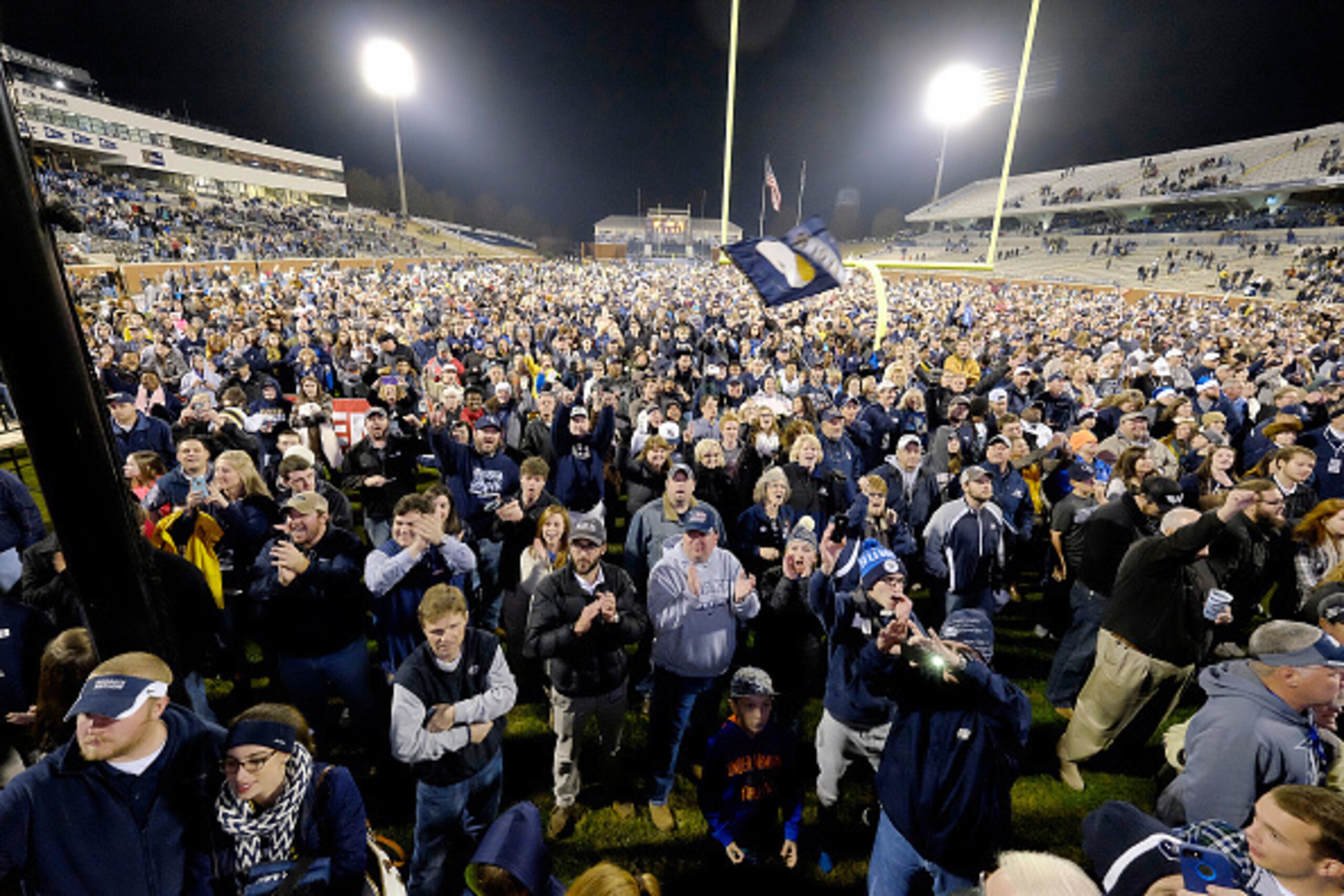 STATESBORO, GA - NOVEMBER 29:  Fans celebrate following the Georgia Southern Eagles' win over the Louisiana Monroe Warhawks on November 29, 2014 at Paulson Stadium in Statesboro, Georgia. Georgia Southern won 22-16.  (Photo by Todd Bennett/Getty Images)