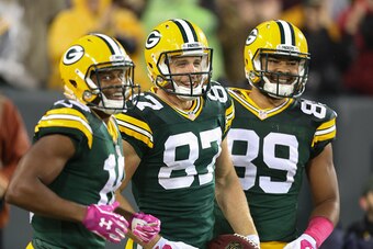 GREEN BAY, WI - OCTOBER 2:  Jordy Nelson #87 of the Green Bay Packers celebrates with Randall Cobb #18 and Richard Rodgers #89 after running the football into the end zone on a 66 yard pass, to score against the Minnesota Vikings in the first half of the 