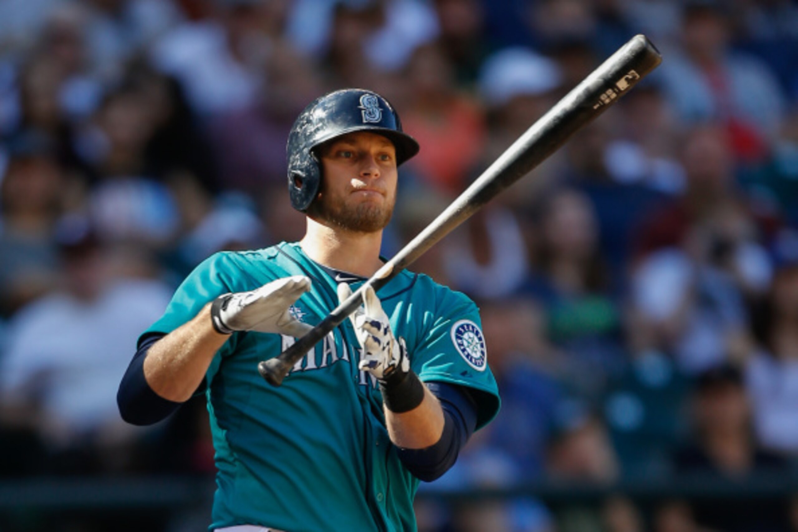 SEATTLE, WA - SEPTEMBER 14:  Michael Saunders #55 of the Seattle Mariners strikes out in the seventh inning  against the Oakland Athletics at Safeco Field on September 14, 2014 in Seattle, Washington.  (Photo by Otto Greule Jr/Getty Images)