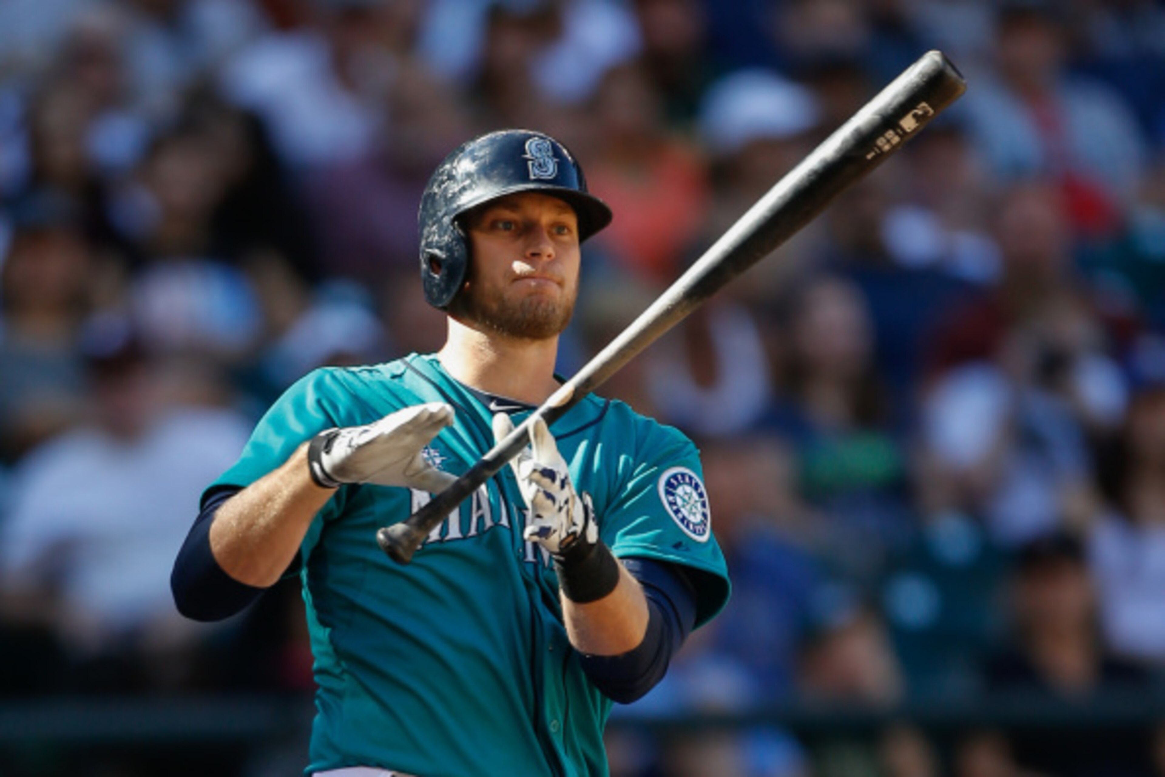 SEATTLE, WA - SEPTEMBER 14:  Michael Saunders #55 of the Seattle Mariners strikes out in the seventh inning  against the Oakland Athletics at Safeco Field on September 14, 2014 in Seattle, Washington.  (Photo by Otto Greule Jr/Getty Images)