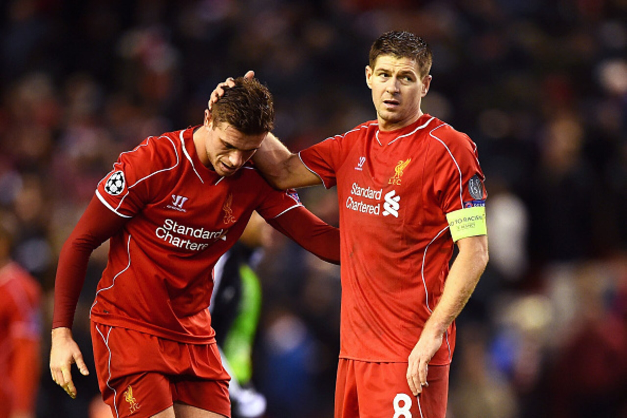 LIVERPOOL, ENGLAND - DECEMBER 09: (L-R) Dejected Liverpool players Jordan Henderson and Steven Gerrard react following their team's 1-1 draw and exit from the competition during the UEFA Champions League group B match between Liverpool and FC Basel 1893 LIVERPOOL, ENGLAND - DECEMBER 09: (L-R) Dejected Liverpool players Jordan Henderson and Steven Gerrard react following their team's 1-1 draw and exit from the competition during the UEFA Champions League group B match between Liverpool and FC Basel 1893