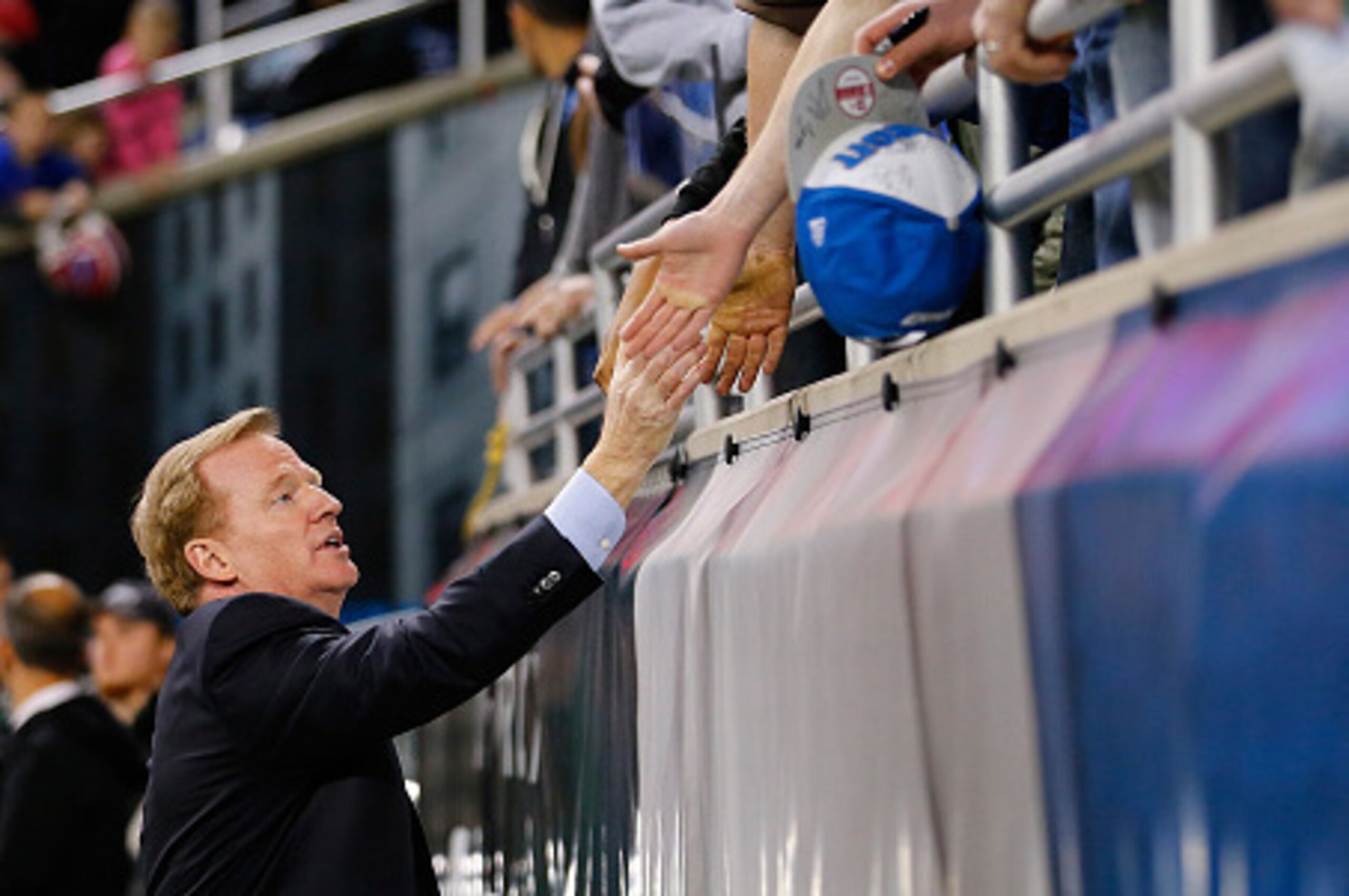 DETROIT, MI - NOVEMBER 24: NFL Commissioner Roger Goodell shakes hands with fans prior to the start or the game between the New York Jets and Buffalo Bills at Ford Field on November 24 , 2014 in Detroit, Michigan. (Photo by Leon Halip/Getty Images)
