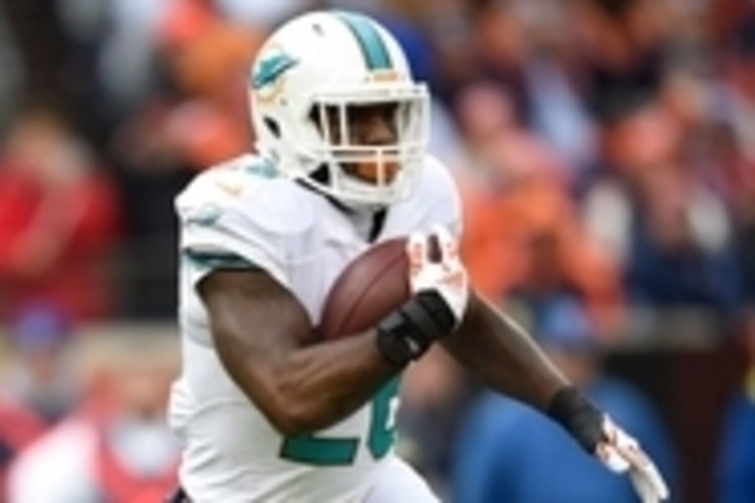 Nov 23, 2014; Denver, CO, USA; Miami Dolphins running back Lamar Miller (26) carries the football in the first quarter against the Denver Broncos at Sports Authority Field at Mile High. Mandatory Credit: Ron Chenoy-USA TODAY Sports Nov 23, 2014; Denver, CO, USA; Miami Dolphins running back Lamar Miller (26) carries the football in the first quarter against the Denver Broncos at Sports Authority Field at Mile High. Mandatory Credit: Ron Chenoy-USA TODAY Sports
