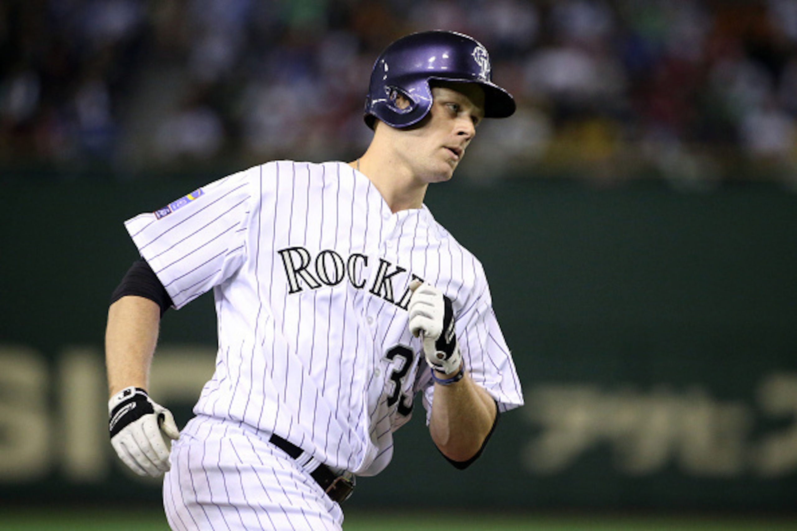TOKYO, JAPAN - NOVEMBER 16:  Justin Morneau #33 of the Colorado Rockies heads home after hitting a three-run homer  in the third inning during the game four of Samurai Japan and MLB All Stars at Tokyo Dome on November 16, 2014 in Tokyo, Japan.  (Photo by 