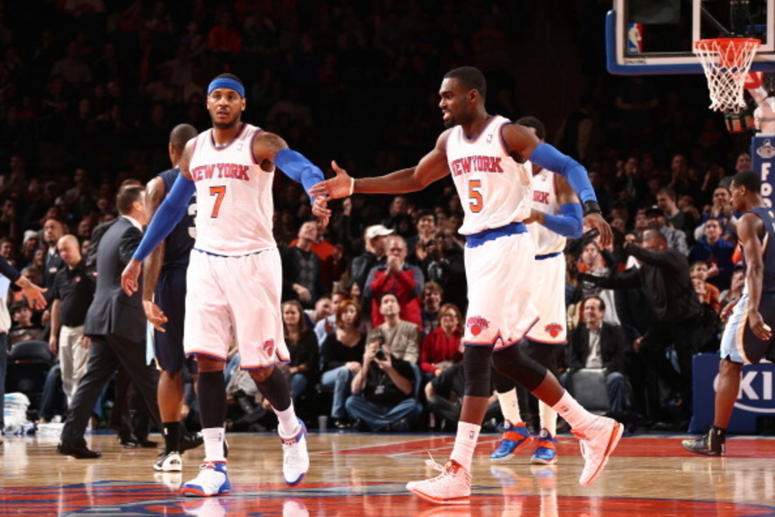 NEW YORK, NY - DECEMBER 21: Teammates Carmelo Anthony #7 of the New York Knicks and Tim Hardaway Jr. #5 of the New York Knicks high five during a game against the Memphis Grizzlies at Madison Square Garden in New York City on December 21, 2013.  NOTE TO U