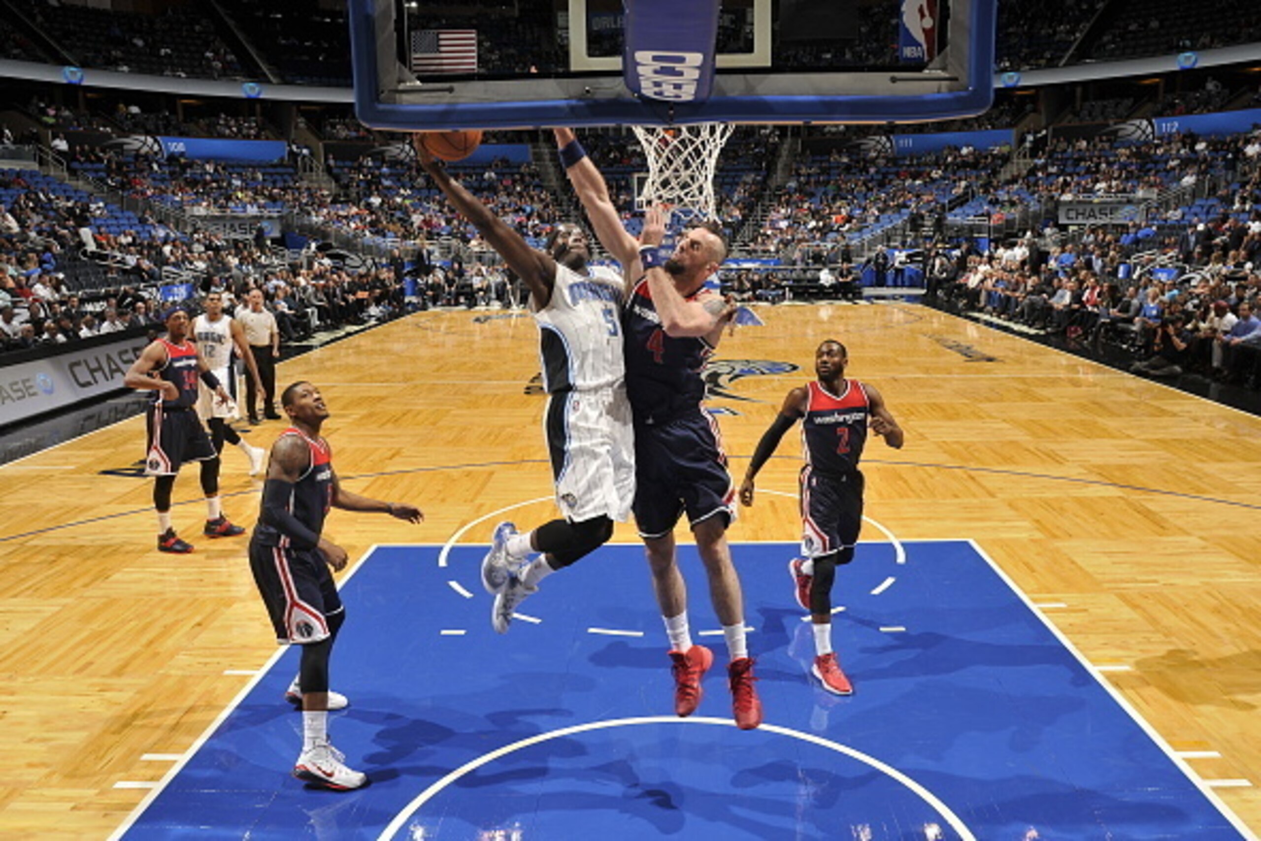 ORLANDO, FL - DECEMBER 10:  Victor Oladipo #5 of the Orlando Magic shoots the ball against Marcin Gortat #4 of the Washington Wizards during the game on December 10, 2014 at Amway Center in Orlando, Florida. NOTE TO USER: User expressly acknowledges and a