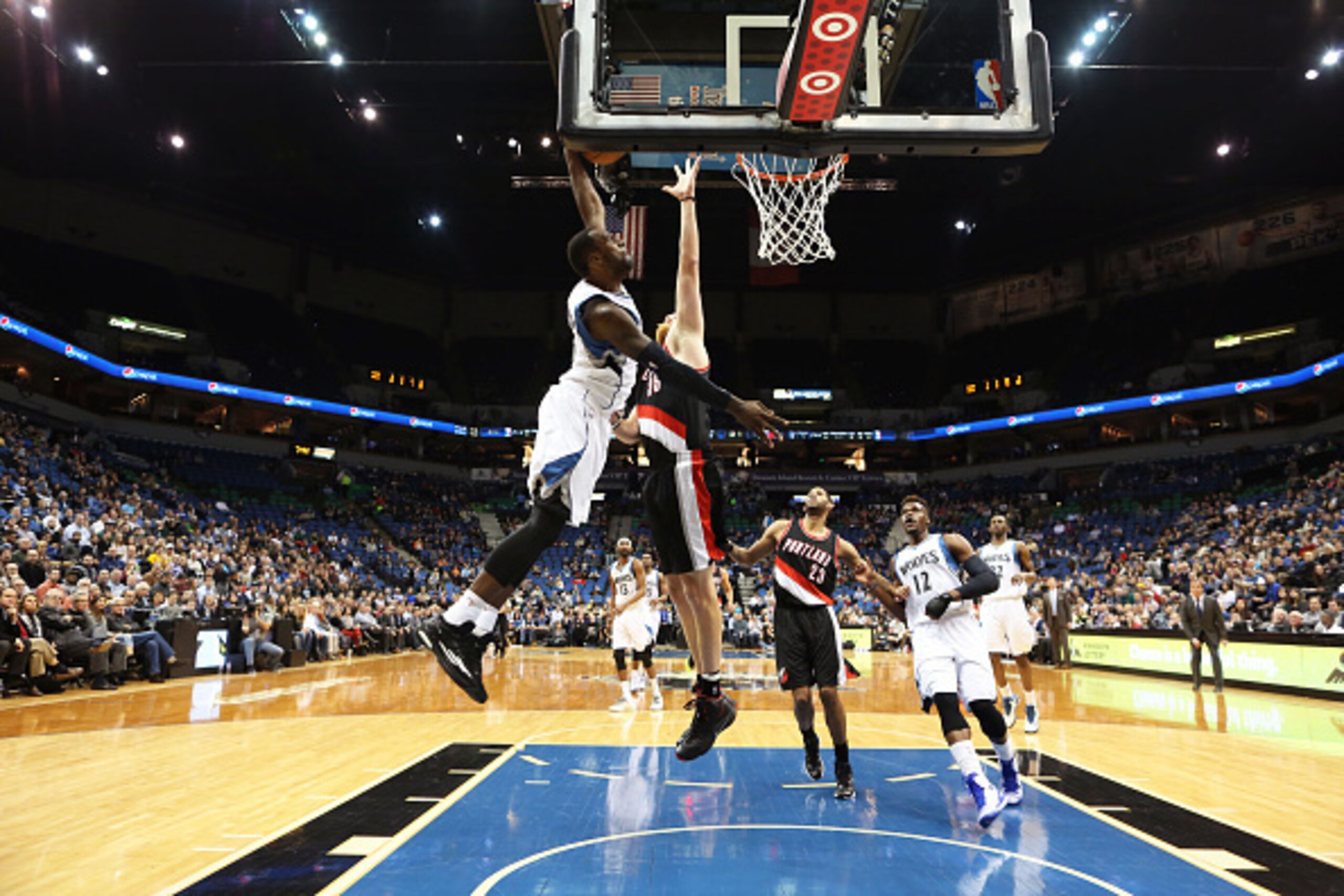 MINNEAPOLIS, MN -  DECEMBER 10: Shabazz Muhammad #15 of the Minnesota Timberwolves dunks against the Portland Trail Blazers on December 10, 2014 at Target Center in Minneapolis, Minnesota. NOTE TO USER: User expressly acknowledges and agrees that, by down