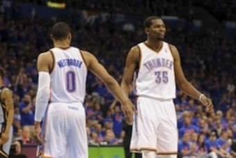 May 3, 2014; Oklahoma City, OK, USA; Oklahoma City Thunder guard Russell Westbrook (0) slaps hands with  forward Kevin Durant (35) after a play in action against the Memphis Grizzlies in game seven of the first round of the 2014 NBA Playoffs at Chesapeake