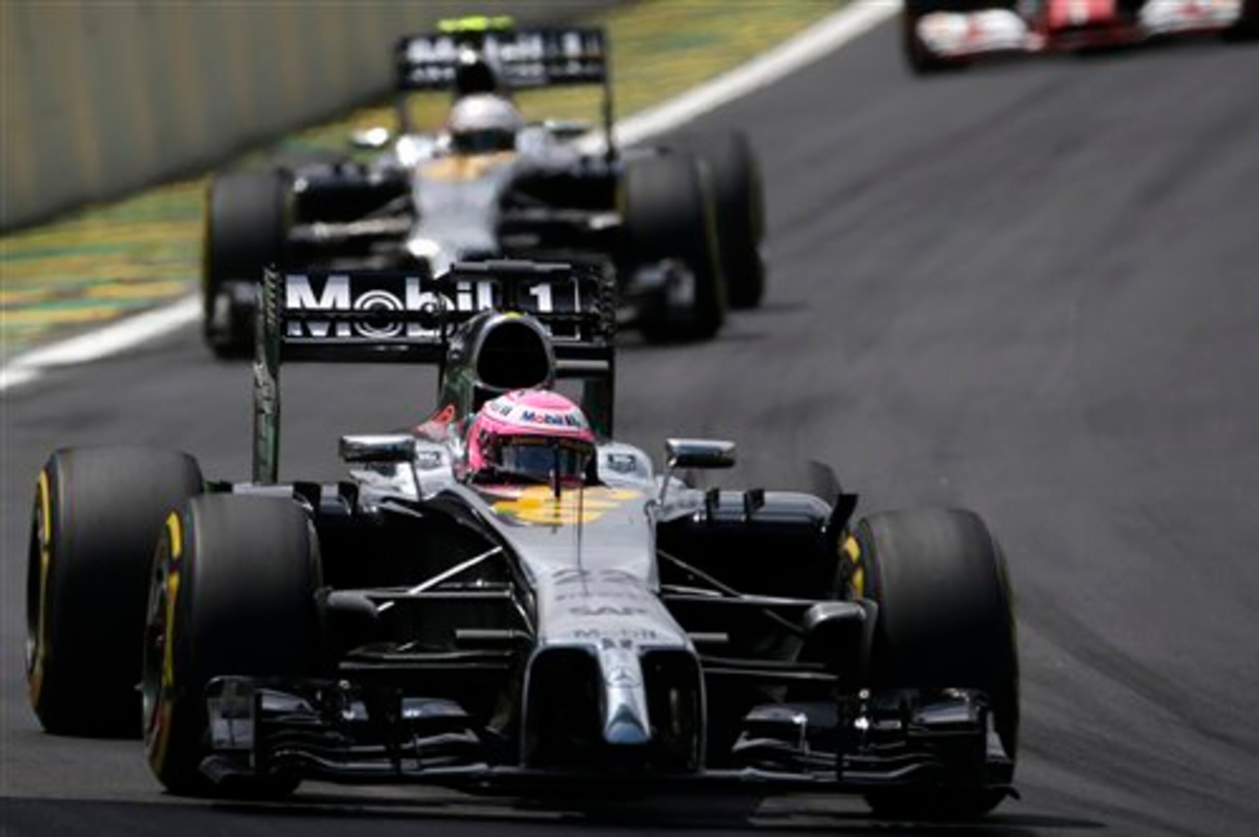 Button leading Magnussen at the Brazilian Grand Prix. Button leading Magnussen at the Brazilian Grand Prix.