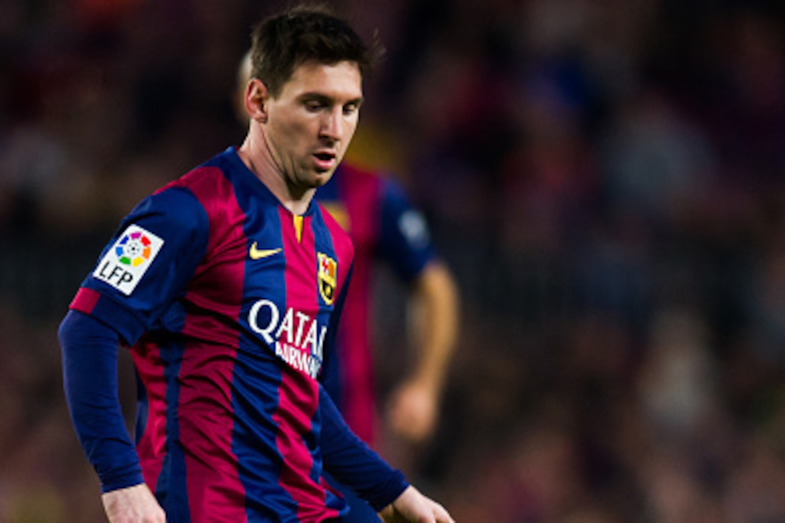 BARCELONA, SPAIN - DECEMBER 07: Lionel Messi of FC Barcelona plays the ball during the La Liga match between FC Barcelona and RCD Espanyol at Camp Nou on December 7, 2014 in Barcelona, Spain. (Photo by Alex Caparros/Getty Images)