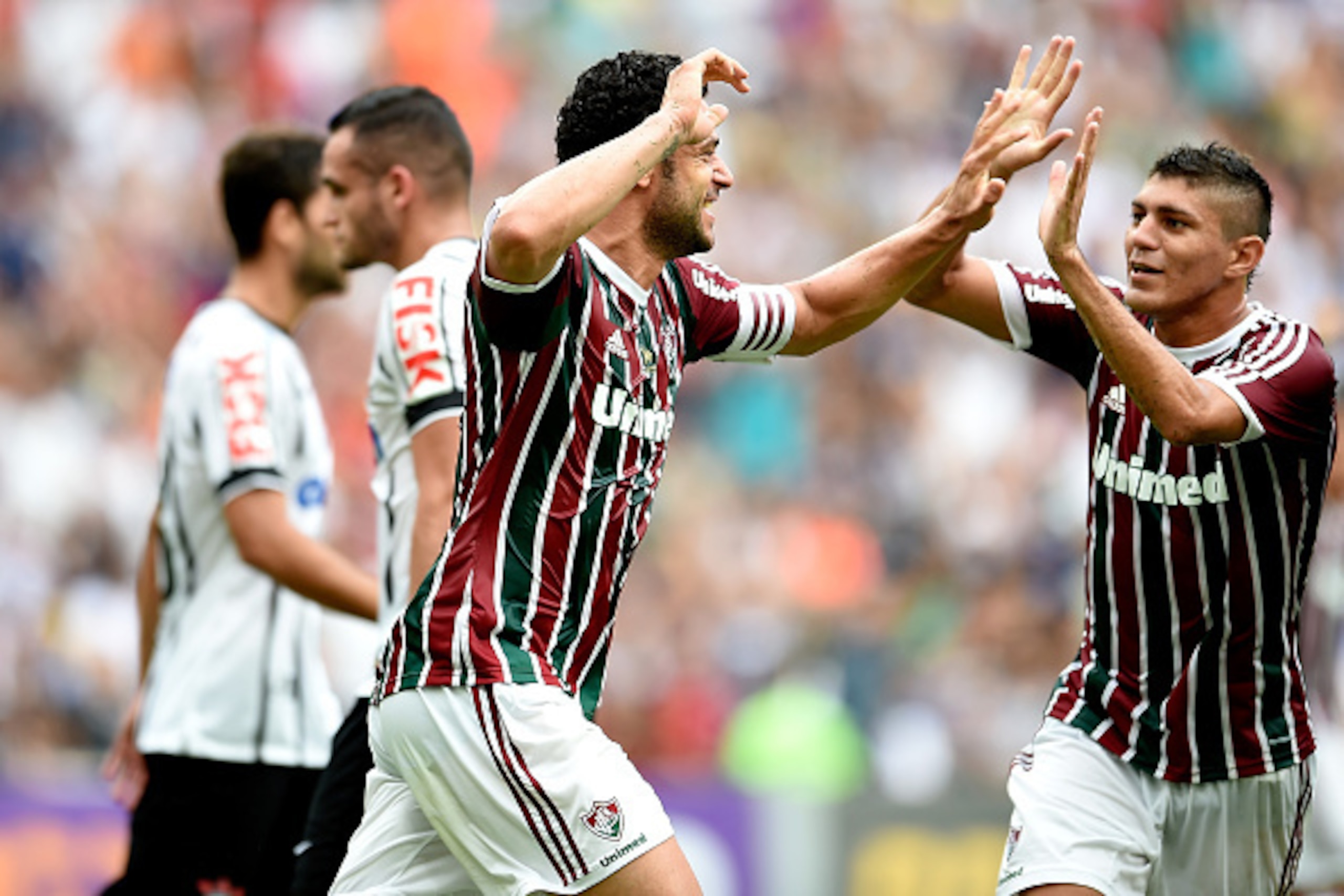 RIO DE JANEIRO, BRAZIL - NOVEMBER 30:  Fred (L) and Edson  of Fluminense celebrate a scored goal against Corinthians during a match between Fluminense and Corinthians as part of Brasileirao Series A 2014 at Maracana Stadium on November 30, 2014 in Rio de 