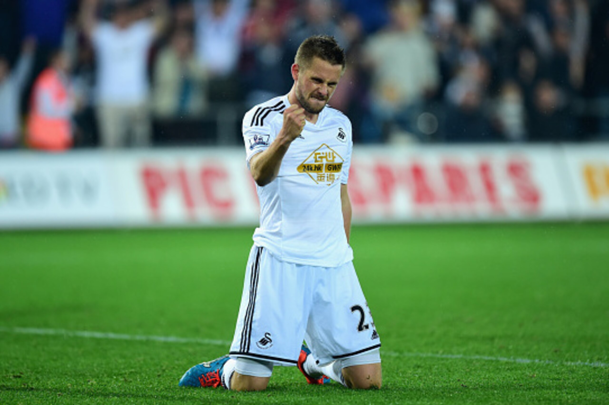 SWANSEA, WALES - SEPTEMBER 23:  Swansea player Gylfi Sigurdsson celebrates after scoring the second Swansea goal during the Capital One Cup Third Round match between Swansea City and Everton at Liberty Stadium on September 23, 2014 in Swansea, Wales.  (Ph