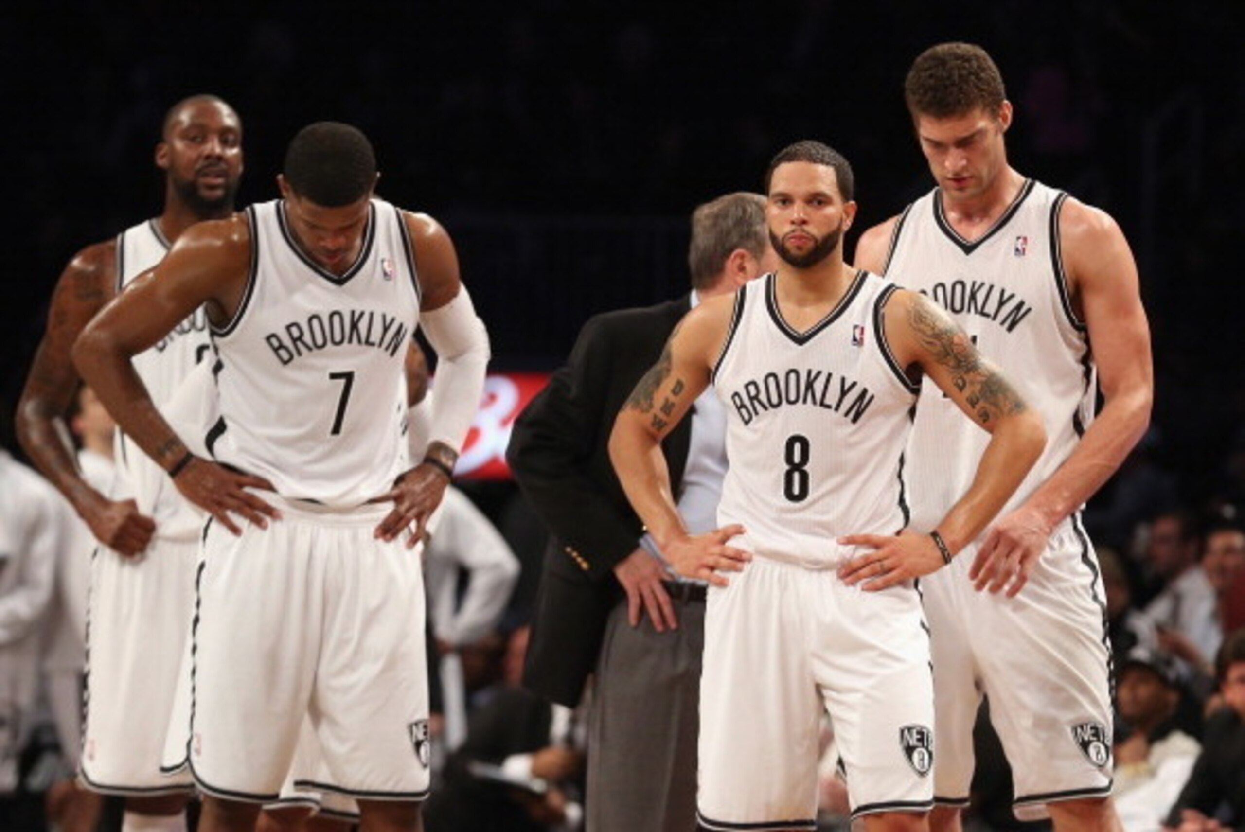 NEW YORK, NY - APRIL 22: (L-R) Joe Johnson #7, Deron Williams #8 and Brook Lopez #11 of the Brooklyn Nets wait for a refs call in the closing minutes of their loss to the Chicago Bulls during Game Two of the Eastern Conference Quarterfinals of the 2013 NB
