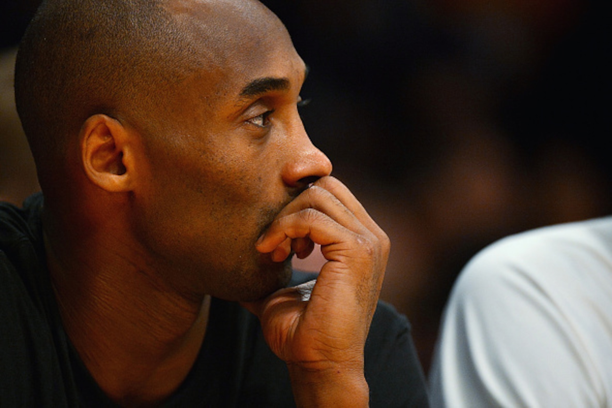 LOS ANGELES, CA - DECEMBER 09:  Kobe Bryant #24 of the Los Angeles Lakers watches from the bench during a game against the Sacramento Kings at Staples Center on December 9, 2014 in Los Angeles, California.   NOTE TO USER: User expressly acknowledges and a