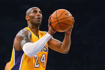 LOS ANGELES, CA - DECEMBER 09:  Kobe Bryant #24 of the Los Angeles Lakers shoots a free throw during a game against the Sacramento Kings at Staples Center on December 9, 2014 in Los Angeles, California.   NOTE TO USER: User expressly acknowledges and agre