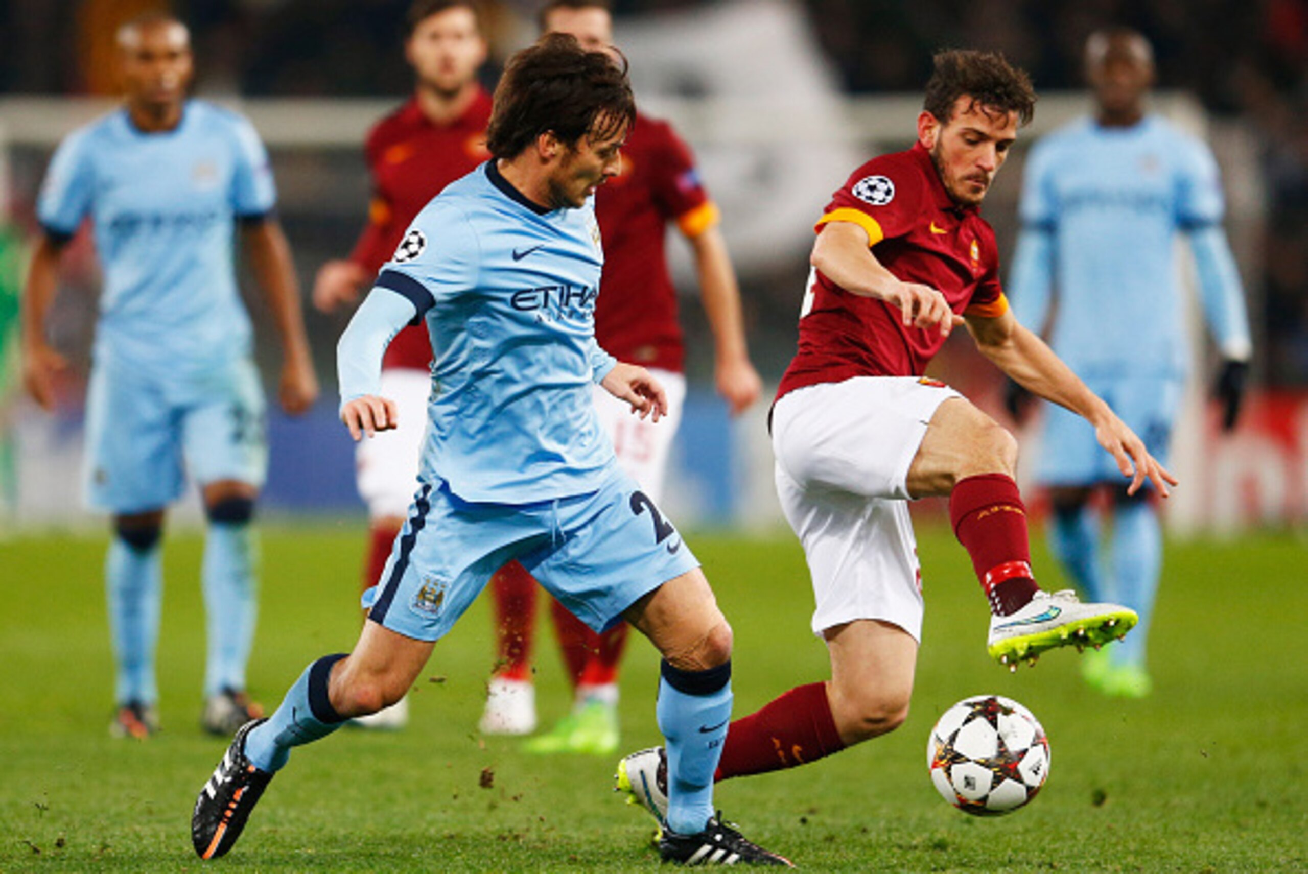 ROME, ITALY - DECEMBER 10:  Mattia Destro of AS Roma battles with David Silva of Manchester City during the UEFA Champions League Group E match between AS Roma and Manchester City FC at Stadio Olimpico on December 10, 2014 in Rome, Italy.  (Photo by Julia