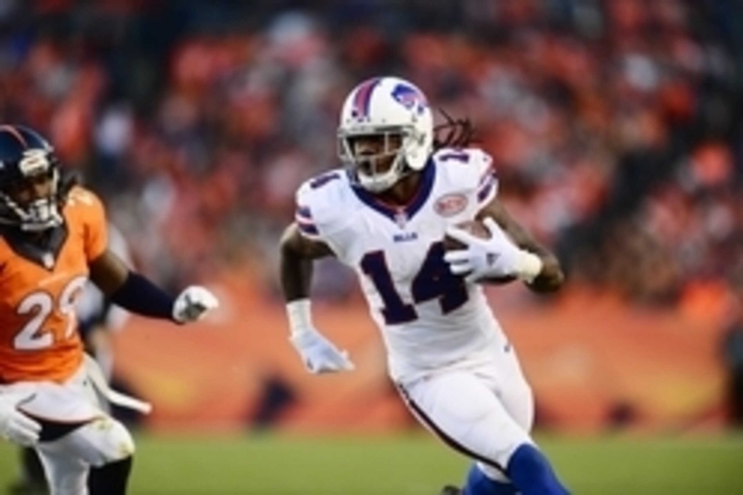 Dec 7, 2014; Denver, CO, USA; Buffalo Bills wide receiver Sammy Watkins (14) carries the football after a reception past Denver Broncos cornerback Bradley Roby (29) in the fourth quarter at Sports Authority Field at Mile High. The Broncos defeated the Bil