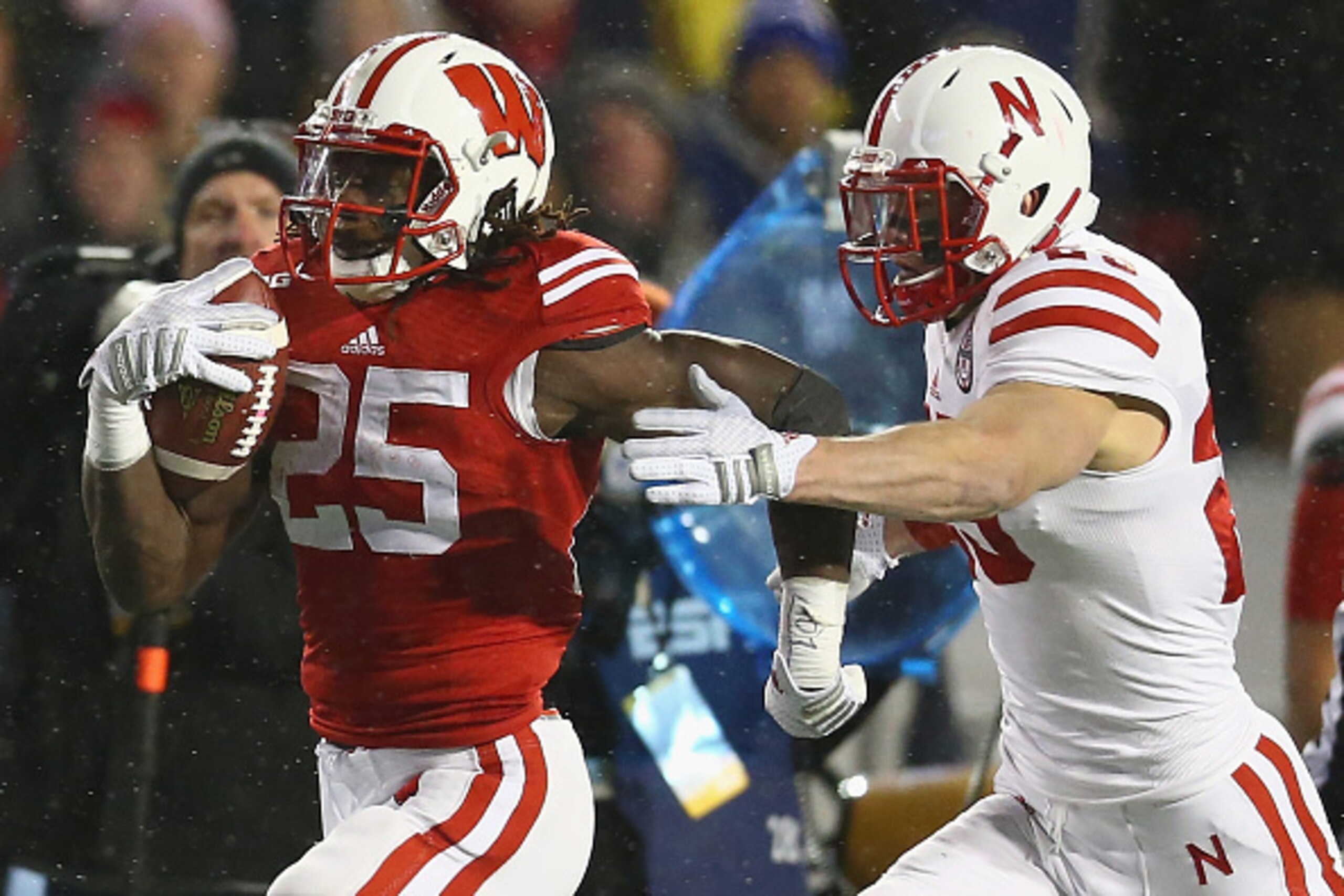 MADISON, WI - NOVEMBER 15:  Melvin Gordon #25 of the Wisconsin Badgers runs the ball against Nate Gerry #25 of the Nebraska Cornhuskers at Camp Randall Stadium on November 15, 2014 in Madison, Wisconsin.  (Photo by Ronald Martinez/Getty Images)