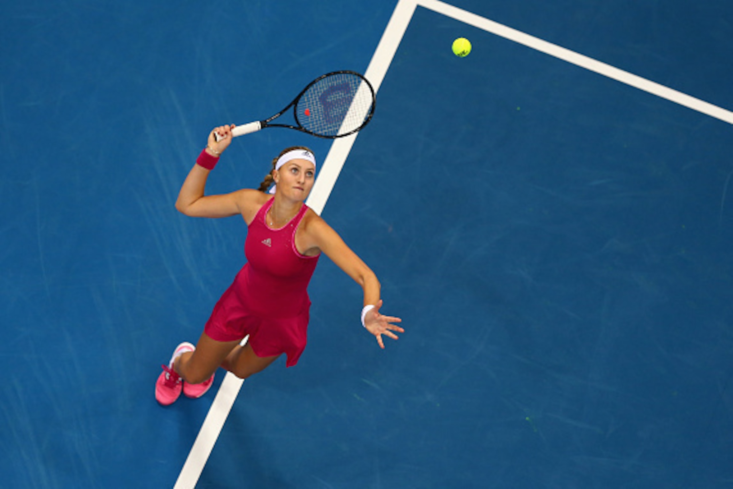 DUBAI, UNITED ARAB EMIRATES - DECEMBER 12:  Kristina Mladenovic of the UAE Royals serves against Daniela Hantuchova of the Singapore Slammers during the Coca-Cola International Premier Tennis League fourth leg at the Hamdan Sports Complex, December 12, 20