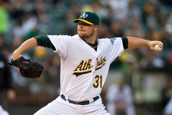 OAKLAND, CA - SEPTEMBER 19:  Jon Lester #31 of the Oakland Athletics pitches against the Philadelphia Phillies during the first inning of an interleague game at O.co Coliseum on September 19, 2014 in Oakland, California. (Photo by Jason O. Watson/Getty Im